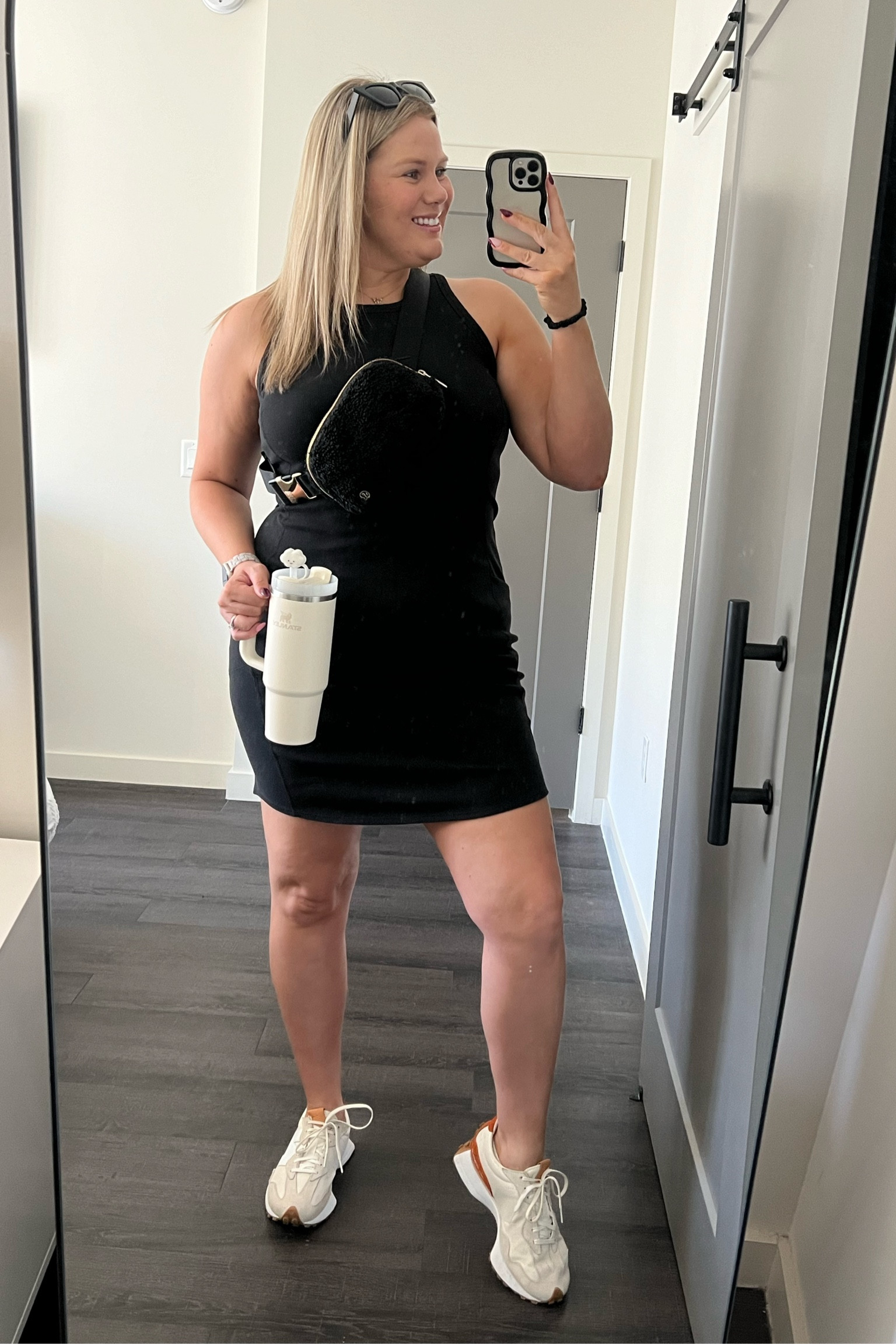 All of the necessary items for a “hot girl walk” this morning. 
South Florida doesn’t really get a fall season but today it feels great! 

This Zella ribbed Athleisure dress is my go to throw on with my favorite new balance sneakers with Lululemon belt bag. 
&& of course my Stanley cup with accessories 

#LTKSeasonal #LTKfitness #LTKmidsize