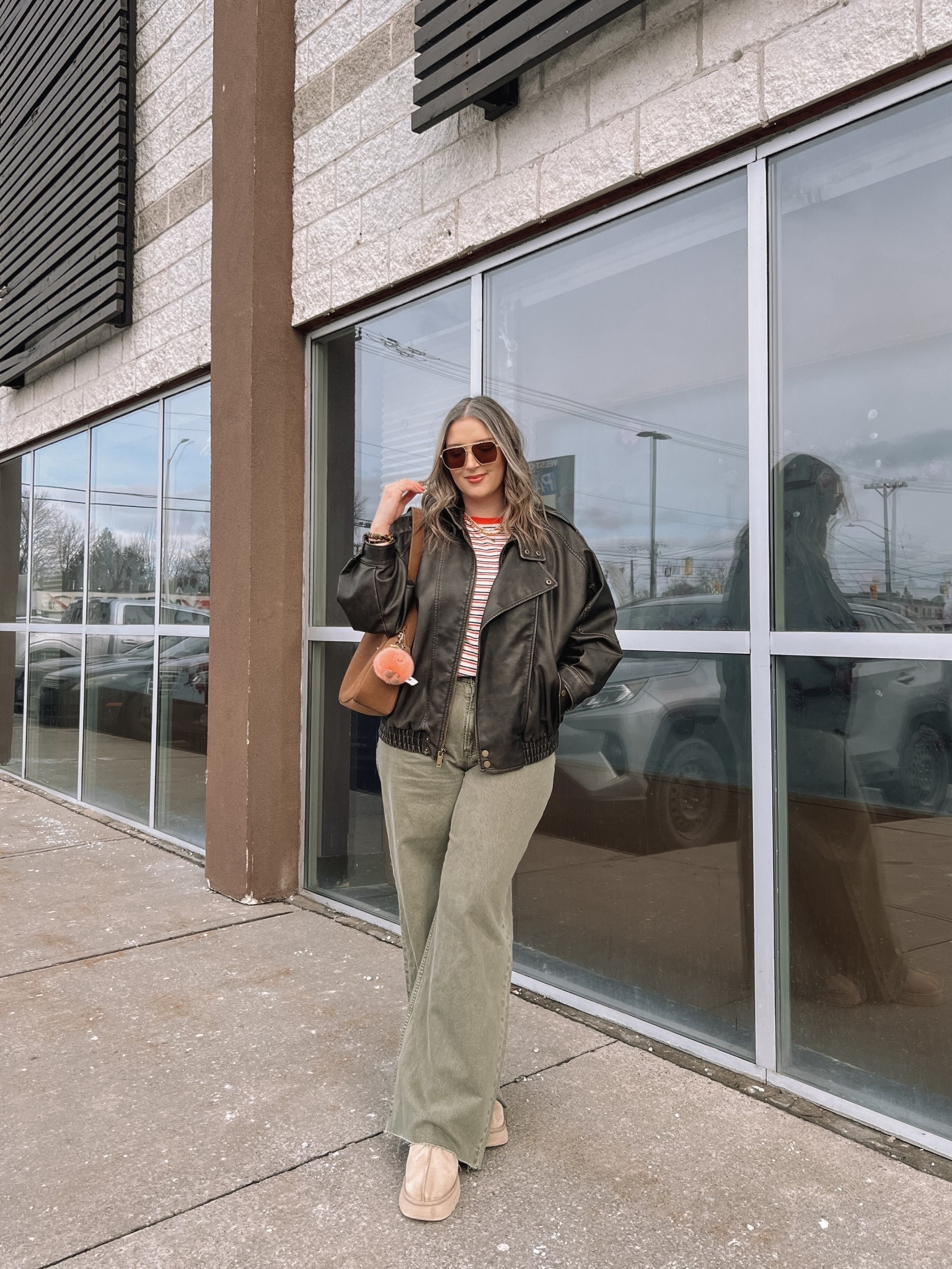 Easy spring outfit! Wearing my usual size L in the leather jacket. Sized up to XL in the striped tee since I have a larger chest and didn’t want it tight. Wearing 32 long in the olive jeans (the long length was a bit too long for me, reg was too short, so I cut the hem for a custom length! Ugg Tazz platforms fit TTS. I wear this coach bag constantly, and the jellycat peach bag charm is so fun for spring!


#LTKmidsize #LTKjeans #LTKsale