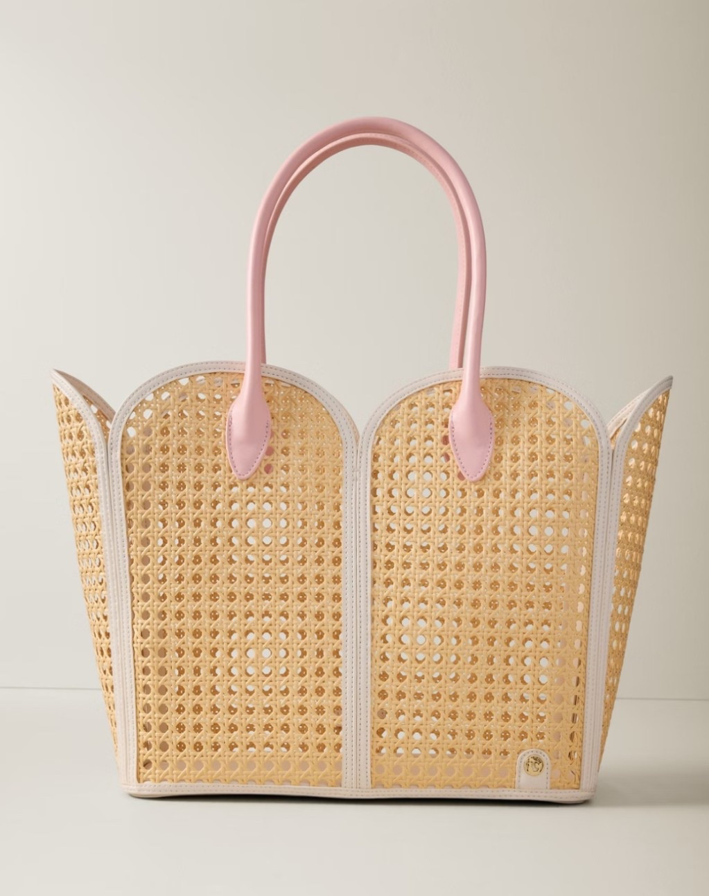 The prettiest beach tote with caning white trim and pink straps. 

#LTKmomlife #LTKTravel #LTKSwim