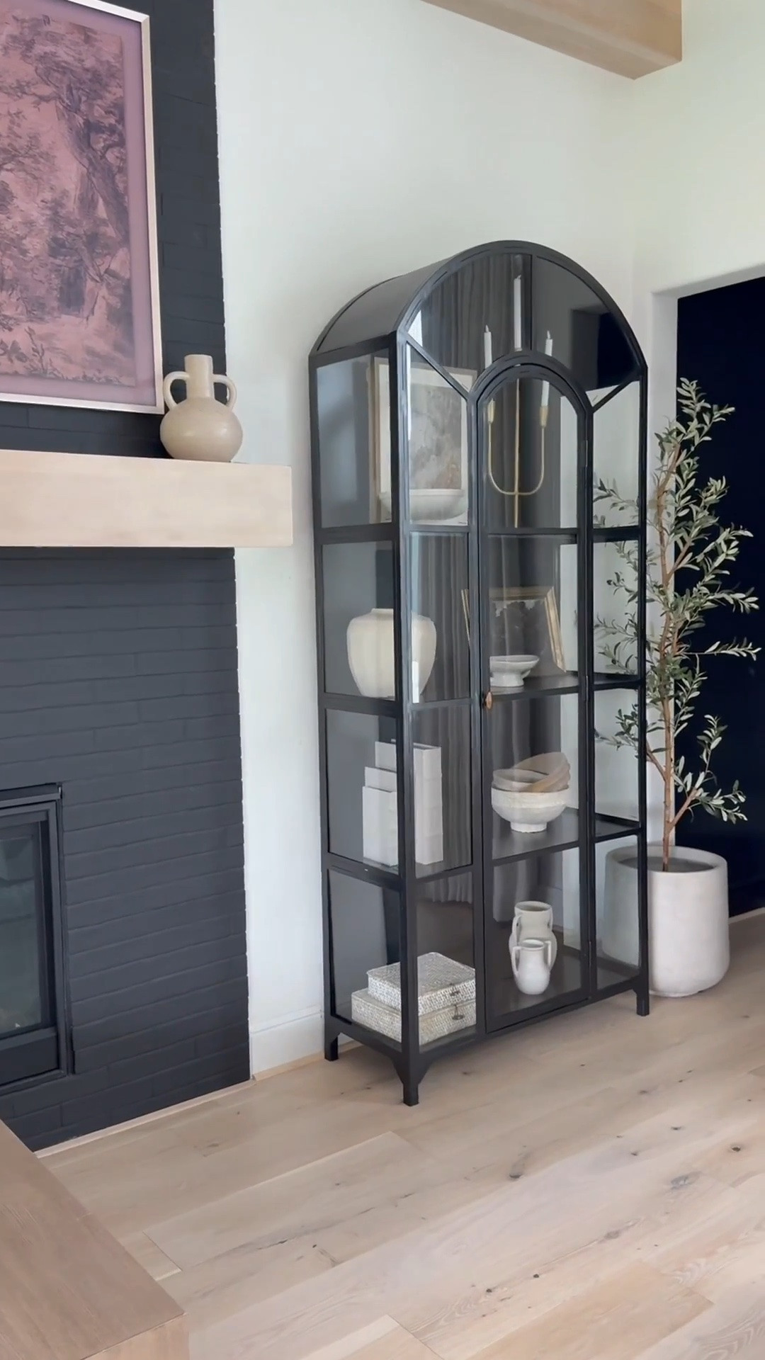 🤎
I've loved this classic cabinet for years plus it's truly a timeless piece that feels heirloom-worthy. ☺️ I love the
arched detail and glass panels that make it look like a work of art.

I now have three in my home! Two in the sitting room and one in the family room — and honestly, l'd add more if I had the space 😬😍

It's perfect for styling any room: dining area, next to a fireplace, bedroom, even an entryway. Solid and sturdy yet surprisingly easy to move. I love filling mine with neutral decor and adding a subtle pop of gold for warmth and contrast. A forever favorite 🖤

👉 I’ve linked the exact product plus similar options for easy purchase!#TimelessDesign #HeirloomQuality #HomeDecorFinds #ClassicStyle #InteriorInspo

#liketkit #LTKHome #LTKSaleAlert