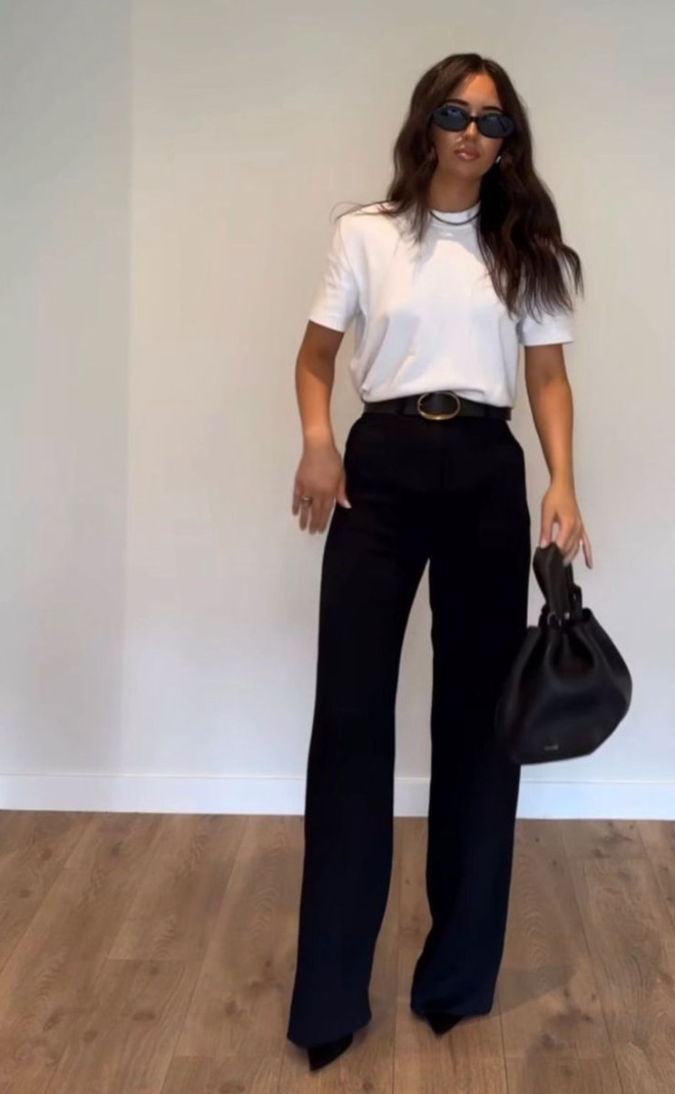 This white t-shirt and tailored trousers outfit is the definition of minimalist style that always looks polished.
A sleek belt, structured black bag, and sharp sunglasses instantly elevate these simple basics into an effortlessly chic everyday look. 

 #LTKSpringSale #LTKootd