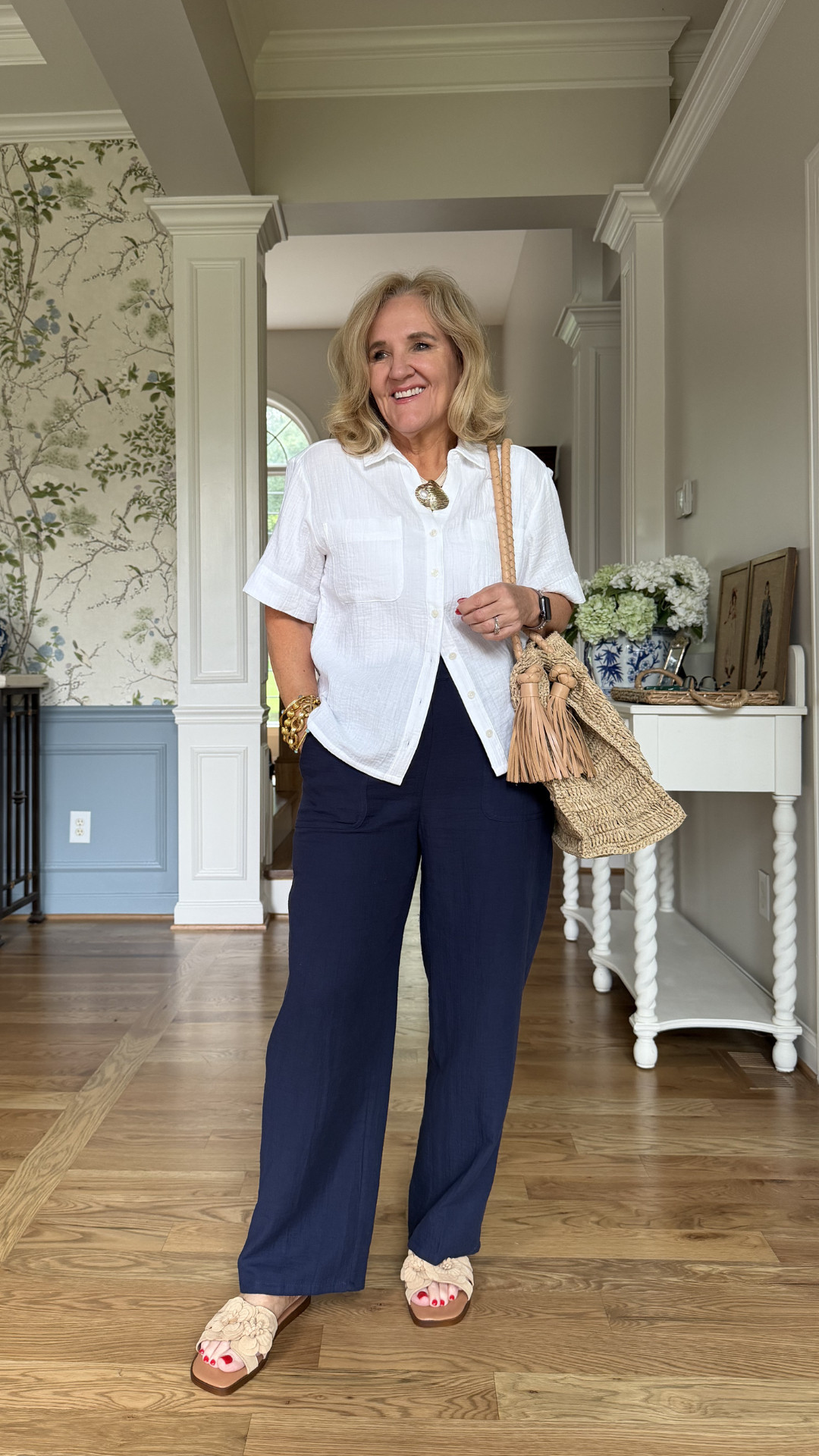 A lightweight white button-front shirt paired with easy navy pants creates that effortless summer look that's comfortable, polished, and perfect for everyday wear. 🫶🏻 

 #LTKootd #LTKOver40 #LTKSaleAlert