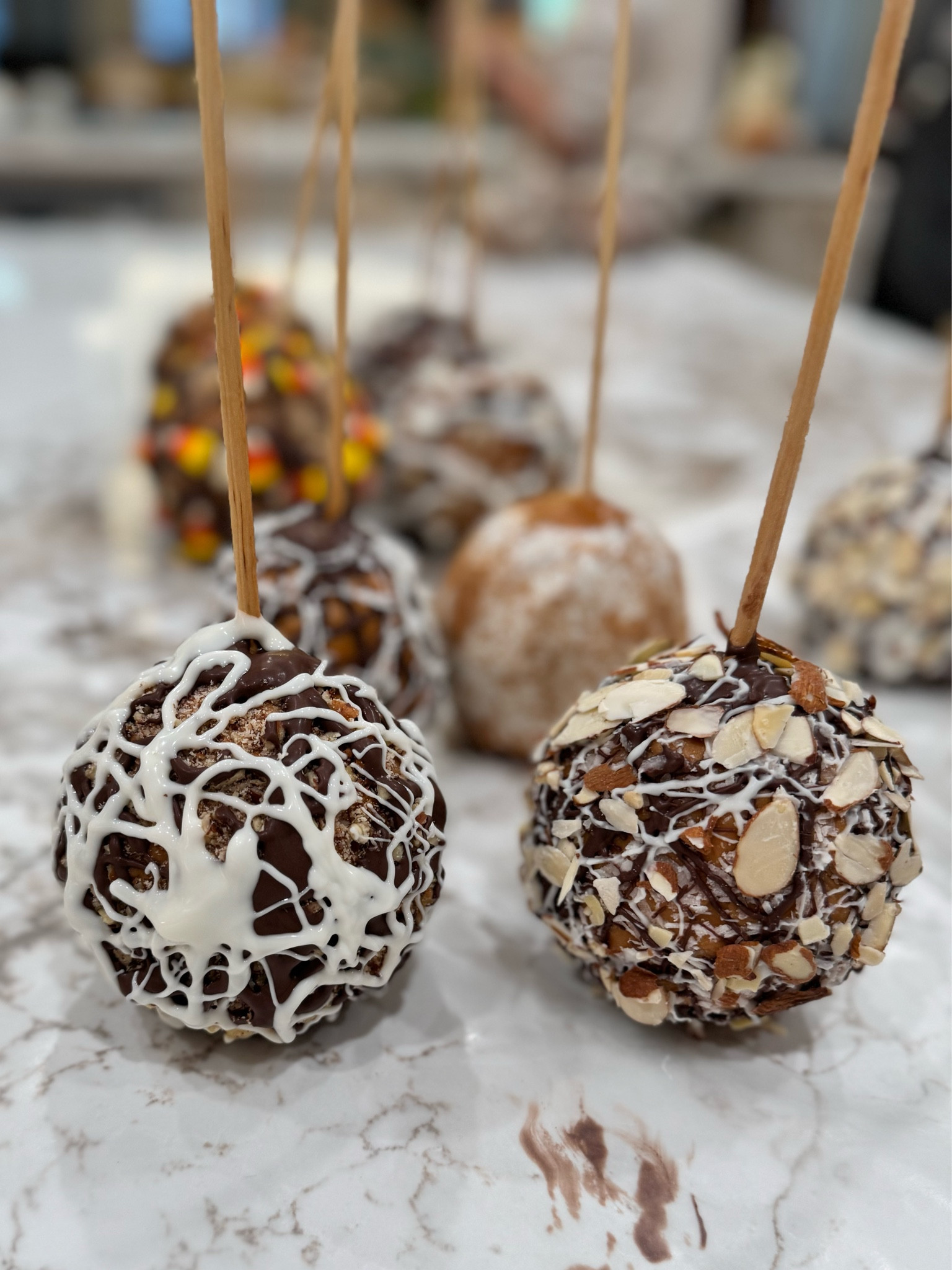 Caramel apple tips- what I learned:
1. Cosmic Crisp apples are best 
2. Save time use caramel bits (one bag/4 apples)
3. Add a little water to bits and melt in microwave. Heat a little at a time; stir, repeat or caramel will burn. Stir. Stir. Stir. And allow caramel to sit for a few hours before adhering to apples. (Cover caramel and it will keep for a long time. It’s just sugar and water).
4. Use dowel rods for sticks because they are sturdier. You need to whittle end you are stabbing through apple. 
5. Spray wax paper with  Pam (but don’t get on apples or caramel won’t stick). 
6. Use spatulas to cover apples completely with caramel and place on waxed paper. The type of spatula matters. You don’t want a flimsy one. 
7. Put dowel rod through each apple. Push gently or you will stab through entire apple and you don’t want that. 
8. Decorate with toppings of choice. 
9. You can find cute cellophane bags at Dollar stores but make sure they open fully to hold an apple.
10. Cute straws and ribbon to decorate 🎀
•I made a turtle apple (roll in toffee crumbles, drizzle with chocolate) 
•Salted caramel (drizzled with white and chocolate)
•almond joy (drizzle with white and chocolate, sprinkle coconut over, add almond slivers)
• drizzled in white chocolate and added candy corn


#LTKParties #LTKHalloween #LTKSeasonal