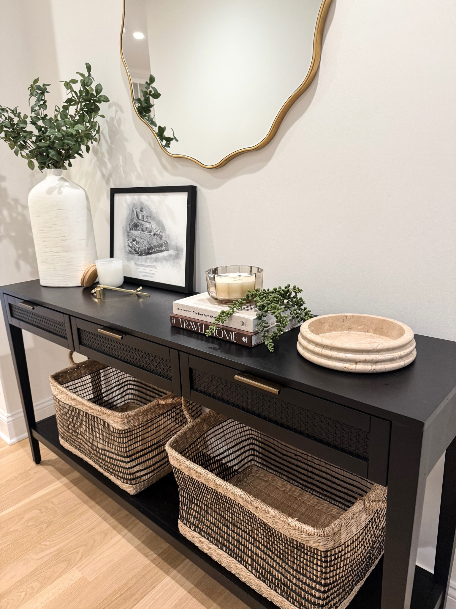 Where function meets beauty — styled surfaces, calming textures, and a quiet palette greet you at the front door!
