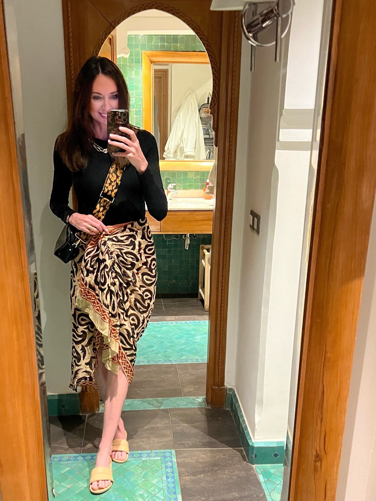 dinner in morocco. took my beek sandals from day to night. 🖤

wearing xs in skirt.

purse and strap are from oliver bonas, sadly they don’t carry either currently. 

#LTKShoeCrush #LTKTravel