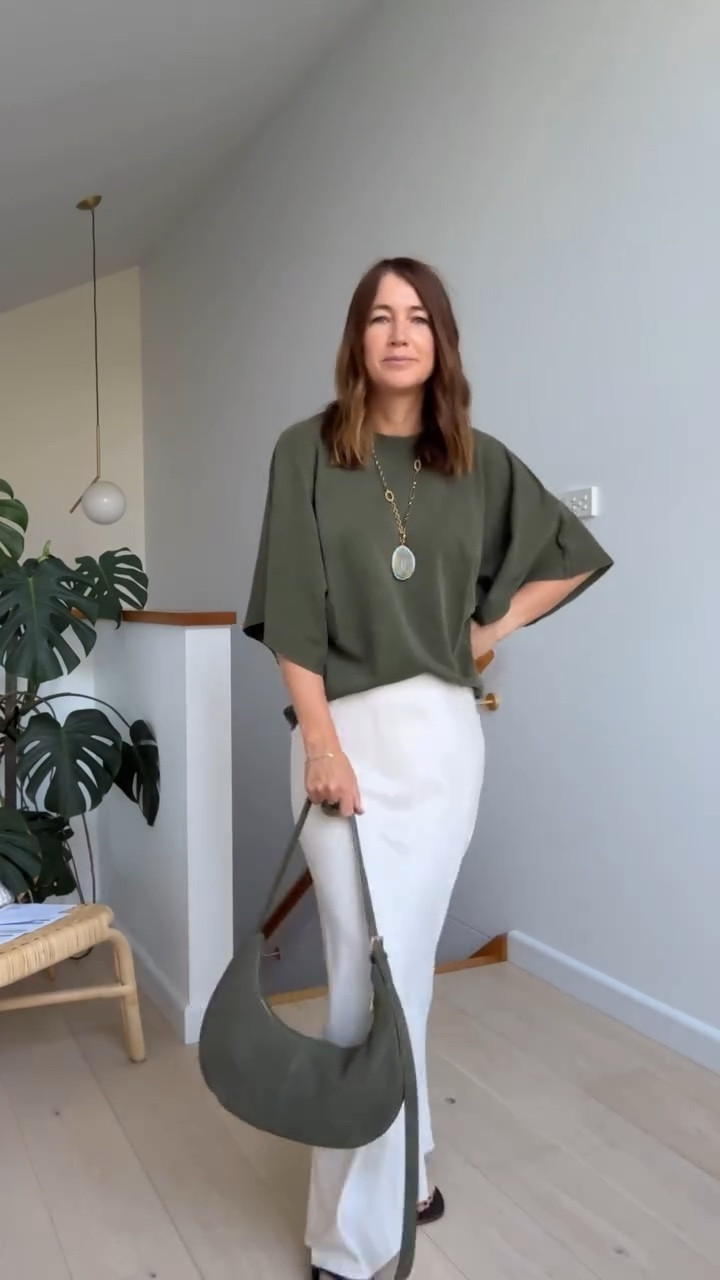 Styling up my new olive Zara tee for work today 🤍

I paired it with a long off-white slip skirt for that effortless, elevated feel. Simple sandals kept it clean and wearable, while a long gold pendant necklace with a green stone tied back perfectly to my matching green bag.

Proof that simplicity can still feel polished and dressy, it’s all in the styling and thoughtful accessories.

An easy modern workwear look that feels relaxed but intentional.

➡️ Follow along if you love modern style with a little edge and refuse to dress boring.

OUTFIT DETAILS
T-shirt @zara.australia - see stories for links
Satin slip skirt @hm (last year)
Brown sandals @hm 
Suede bag @kmartaus 
Necklace @zara.australia (old)

#zara #kmart #zarafinds #kmartfinds #slipskirt