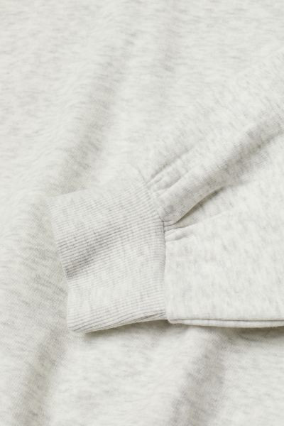 Sweatshirt hoodie in a soft cotton blend with a lined drawstring hood. Gently dropped shoulders, ... | H&M (US + CA)