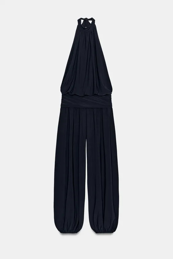 Model height: 178 cmHalter neck jumpsuit with open shoulders. Wide-leg design with cuffed hems. B... | Zara UK
