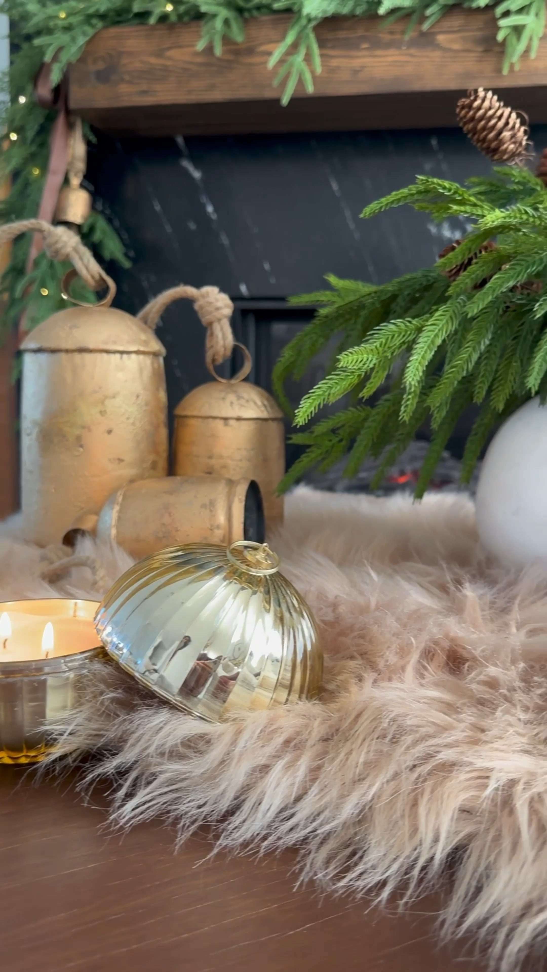 Amazon holiday coffee table styling. Christmas decor. Faux fur hide rug, Norfolk pine, ornament candle mercury glass, rustic holiday gold bells, electric lighter.

#LTKHome #LTKSaleAlert #LTKHoliday