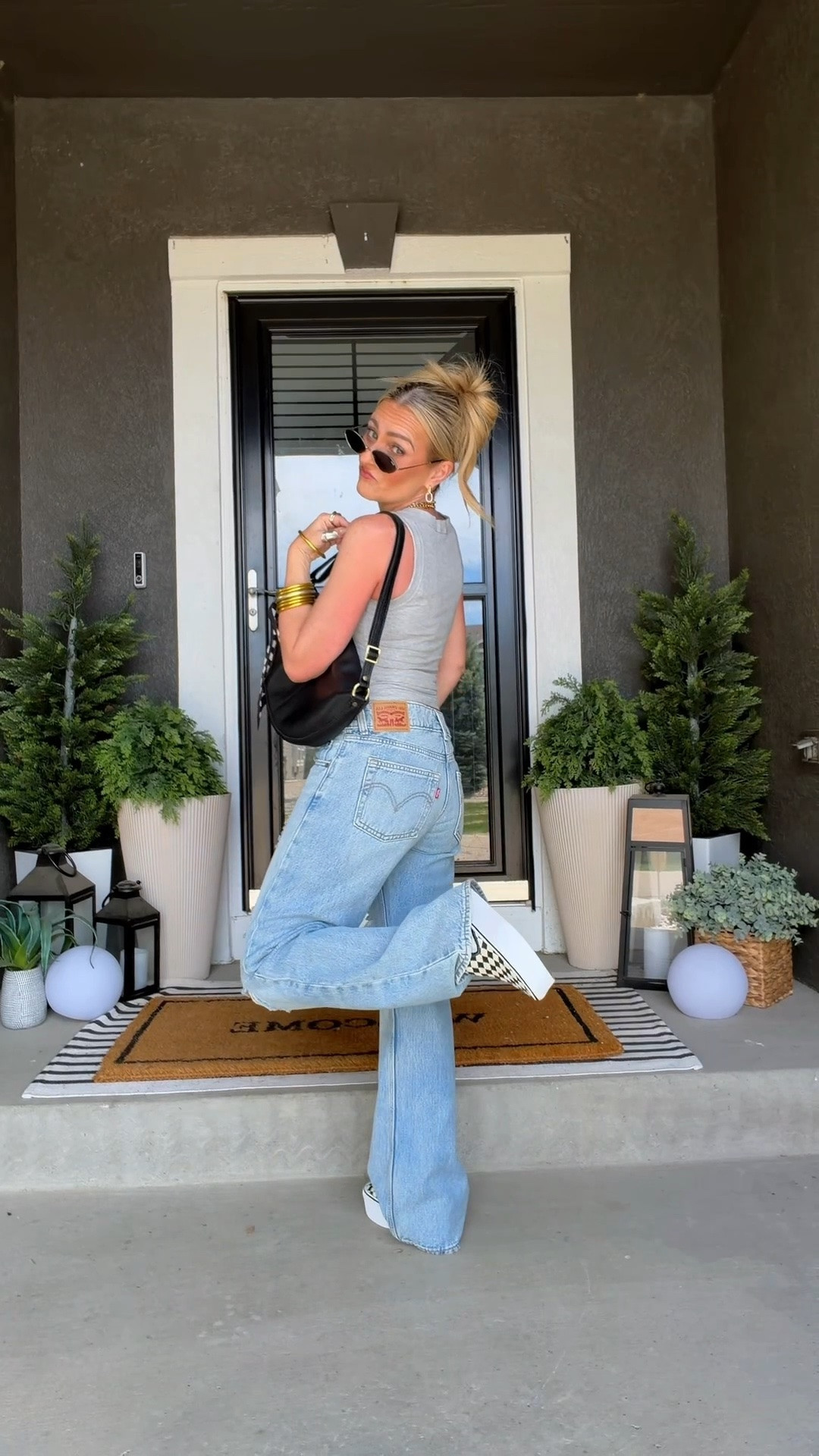 Distressed Levi’s, checkered Vans, and a full-grain leather bag are the kind of pieces that do all the heavy lifting. Casual, comfortable, and just enough throwback energy to make a basic jeans-and-tank outfit feel like an actual outfit.

#LTKootd #LTKmomlife #LTKPetite