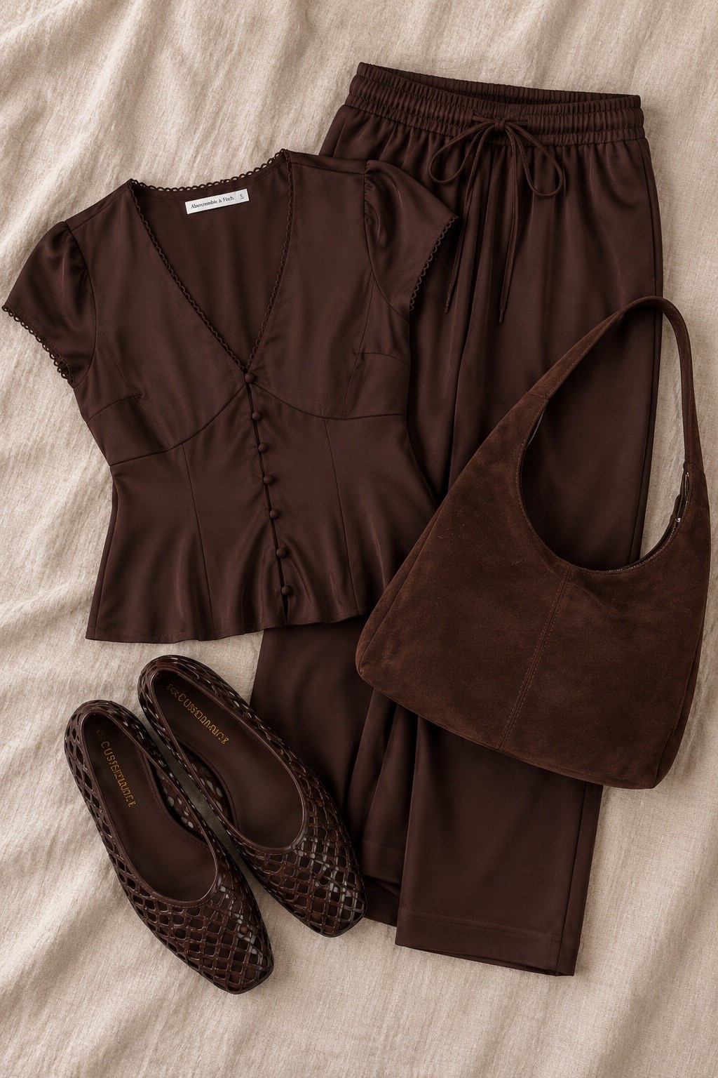 Chocolate brown is having its moment 🤎🍂 This Abercrombie look is giving effortless fall—satin pants, the prettiest feminine top, woven flats + a suede bag to pull it all together. Comfy enough for all day but still cute enough for dinner or date night. Linking the full look on LTK! ✨

#Abercrombie #AbercrombieStyle #FallOutfit #FallFashion #ChocolateBrown #NeutralStyle #CasualChic #LTKStyle #LTKFinds #Fall2026

#LTKootd #LTKSeasonal #LTKSaleAlert