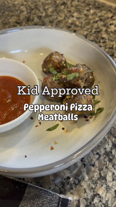 The whole family is loving these kid-approved pepperoni pizza meatballs!! I slightly adapted the recipe from @fedandfit to make it gluten free. I also doubled the batch and made almost 100 meatballs!!  I’ll freeze half of them for us to eat another week. Here’s the recipe for one batch of meatballs:

Ingredients 
1 pound ground beef
1 pound ground Italian sausage
1 cup diced pepperoni
½ cup parmesan cheese (I used grated but you can also use shredded)
½ cup panko (or bread crumbs)
1 egg
2 tablespoons Italian seasoning
2 teaspoons sea salt
½ teaspoon ground black pepper
3 mozzarella cheese sticks cut into ½-inch pieces
12 ounces pizza sauce warmed, optional
¼ cup fresh basil, optional
Red pepper flakes, optional

Directions 
Add the ground beef, Italian sausage, diced pepperoni, parmesan, panko, egg, Italian seasoning, salt, and pepper to a large bowl and use your hands to mix the ingredients together until fully combined.
Use a scoop to scoop the meatball mixture, and place on a sheet pan (I lined mine with aluminum foil and sprayed it with nonstick cooking spray first)  
Place a ½-inch piece of mozzarella cheese in the center of each meatball and roll the meatball, making sure that the cheese stays in the center.
Bake the meatballs at 400°F for 22-25 minutes,  or until browned.
Serve with warm pizza sauce for dipping, and garnish with red pepper flakes and basil. 

You can also customize these with diced onions, bell pepper, olives, or really any pizza topping!  

Healthy recipe, kids recipe, home finds, dinner 

#LTKhome #LTKfamily