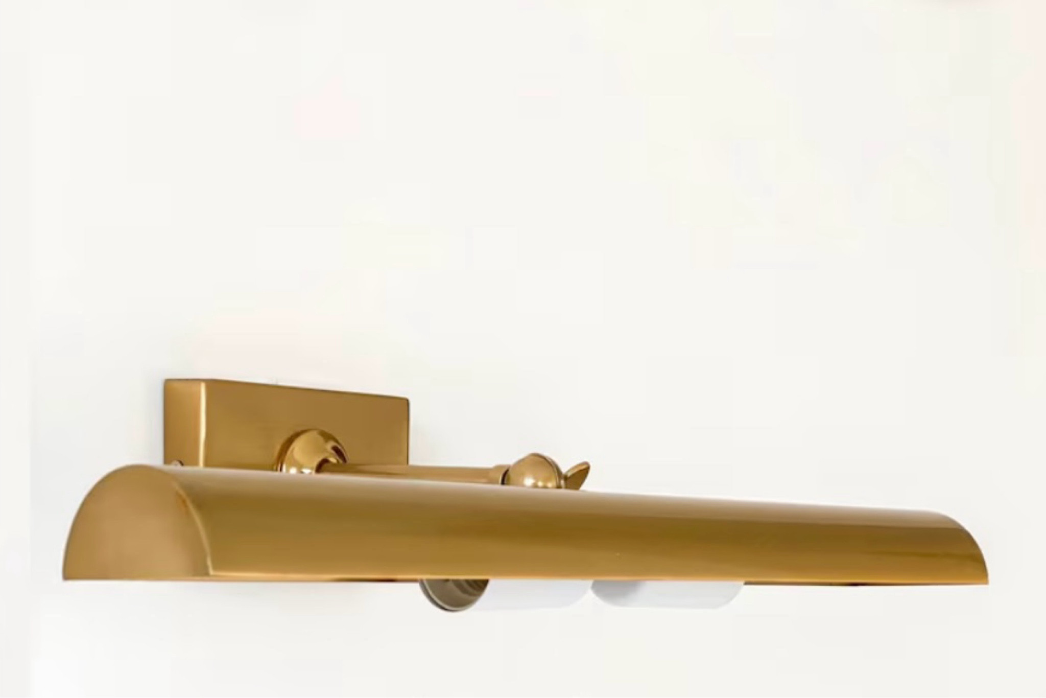 Looking at this brass picture light to go over a cabinet I bought!

#LTKfamily #LTKhome