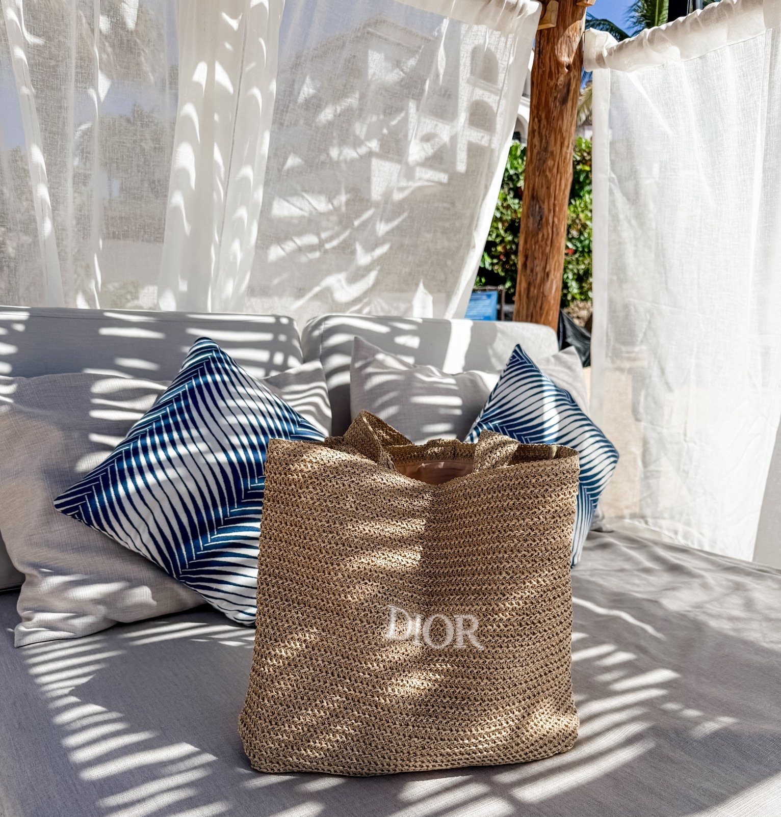 Dior beach bag for your next beach day or tropical trip! 

#LTKSwim #LTKTravel