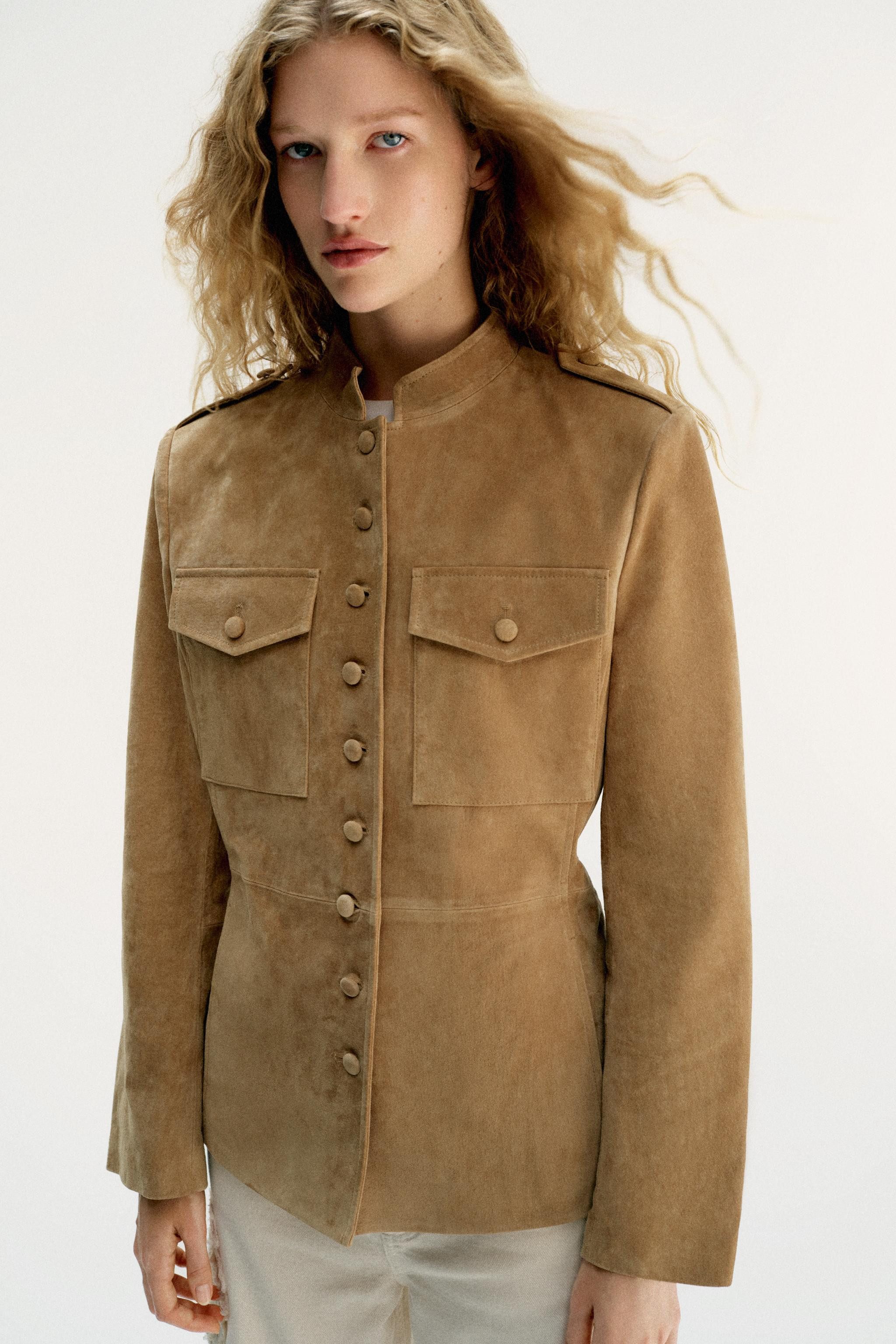 Jacket made from 100% leather. Features a stand-up collar and long sleeves with shoulder tabs and... | Zara US