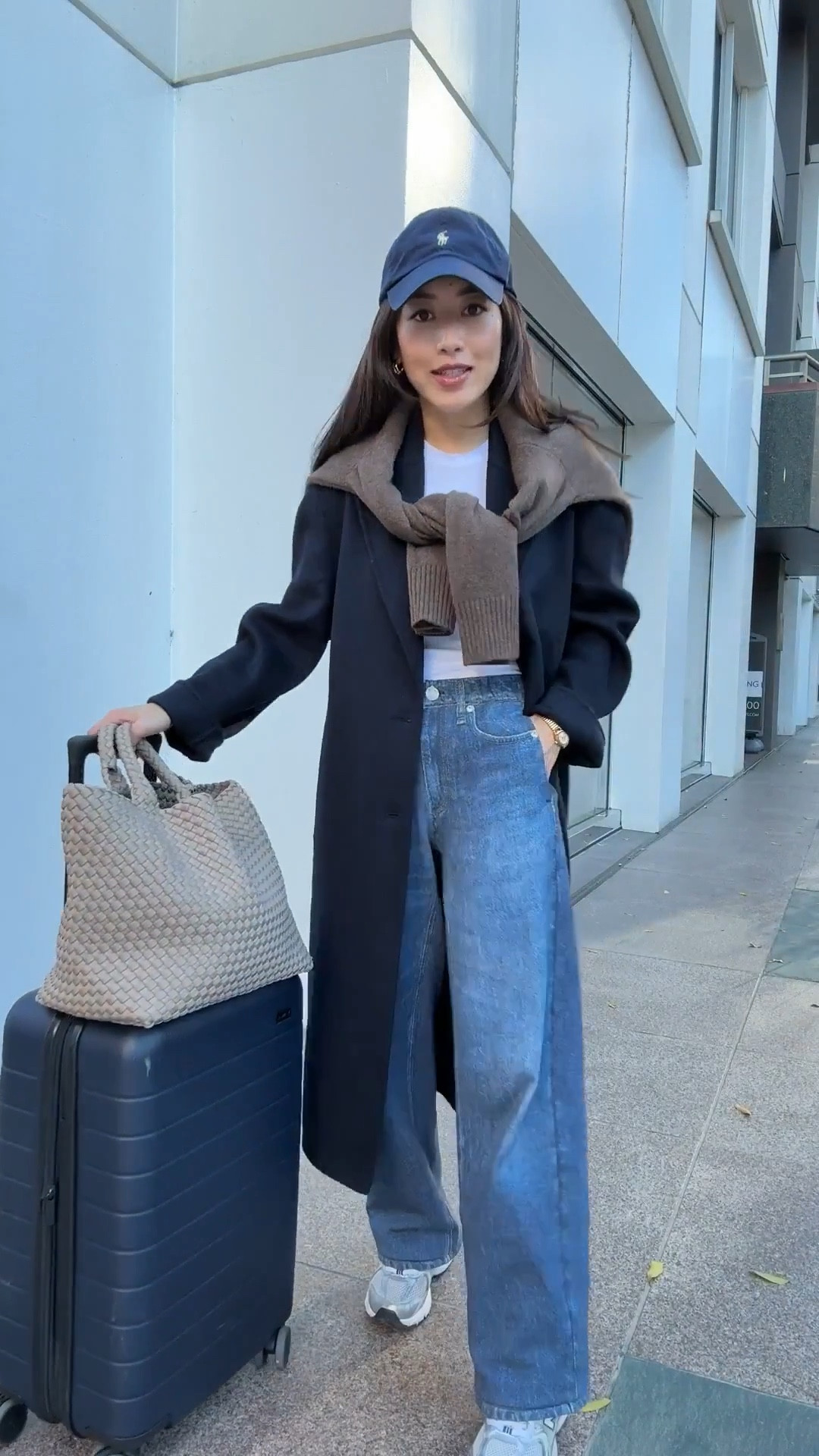 FYI these jeans arrive long and shrink 2-3” in length when you machine wash & dry them! 

• Aritzia double face wool coat xxs - light weight & unlined. 

• Rag & Bone Miramar wide leg pants in XXS , shrunken in dryer and then hemmed. stretch pull on waist. Petra wash. 

I shrunk the length by drying in machine dryer then hemmed an inch. 

I Also linked the R&B Miramar Andi 26.5” cropped style I love that does not need hemming or shrinking,

• Aritzia HomeStretch ribbed long sleeve tee I size up to XS

• Quince Mongolian cashmere oversized crewneck sweater xs, relaxed boxier cut

• New Balance 530, a big kids 4 = womens 6

• Naghedi medium tote in cashmere

• Away the bigger flex carry-on suitcase, lightweight, roomy size and durable. I've traveled a lot with this.

• look 2 Steve Madden boots 5.5 super comfy

• quince  sweater Xs shrunken fit

• Polene Beri black bag not linkable 

Airport travel outfit, sweatpant jeans, petite friendly 

#LTKTravel #LTKPetite #LTKootd