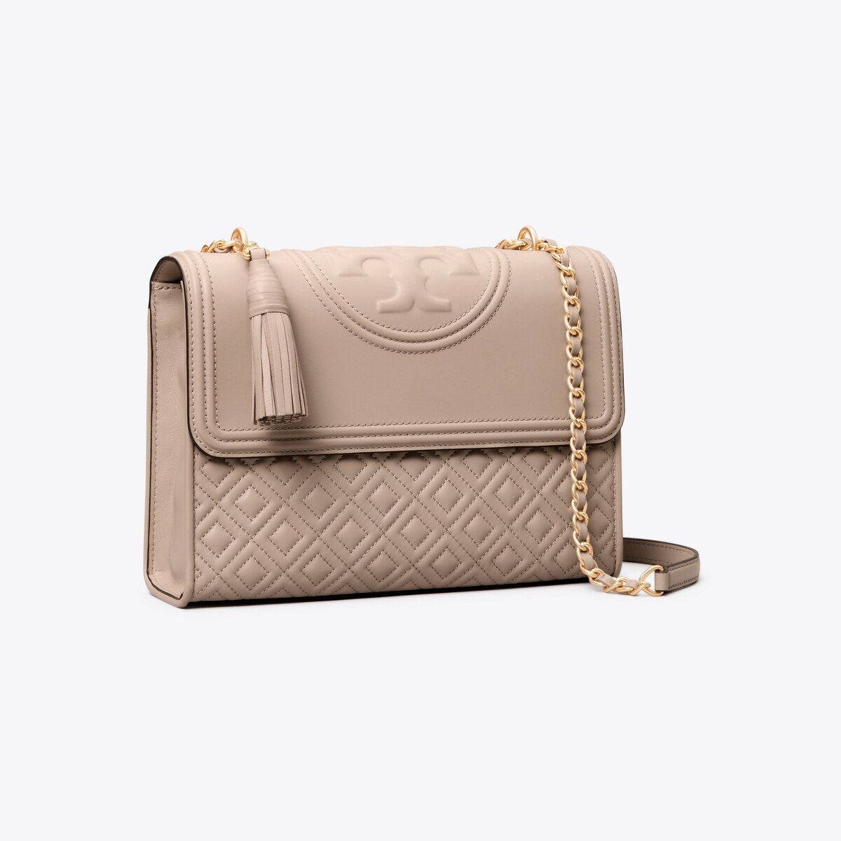 Ladylike quilting and chains: the link to a pulled-together look. The Fleming Convertible Shoulde... | Tory Burch (US)