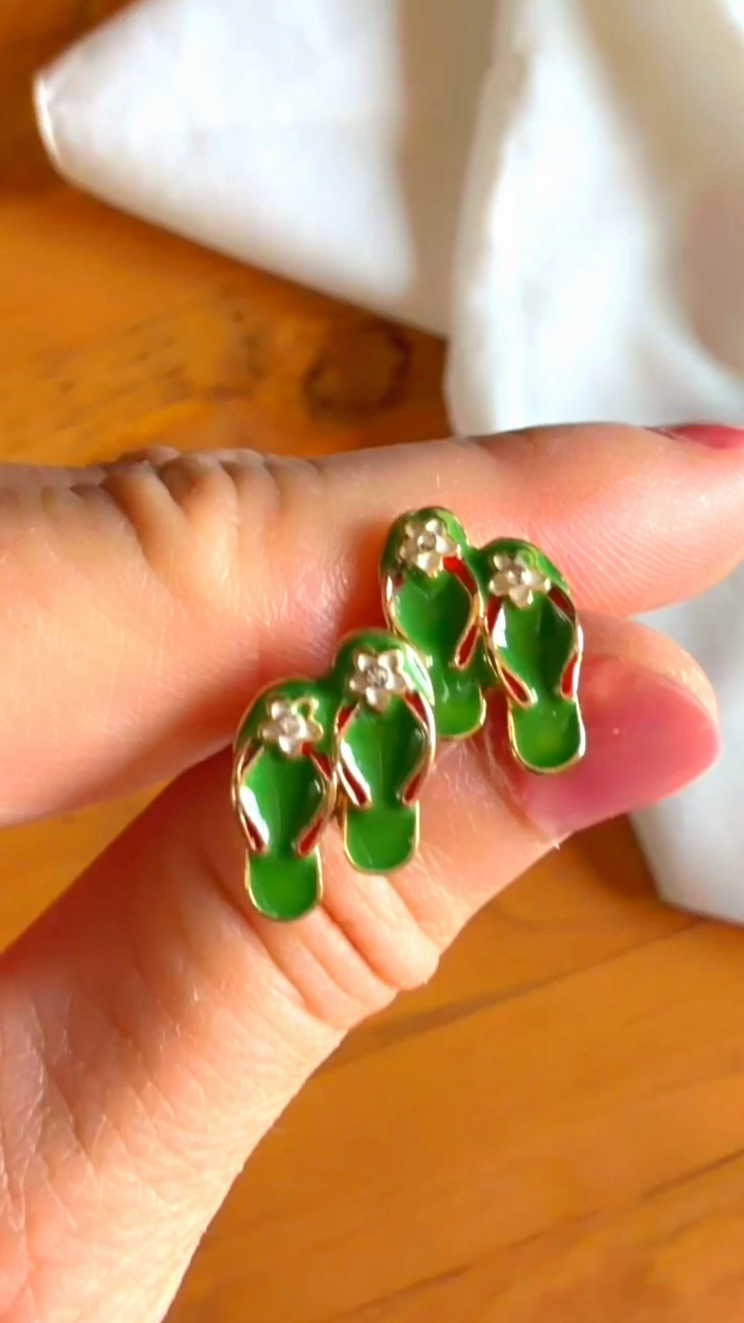 The cutest summer accessory! These adorable green enamel flip-flop stud earrings feature gold trim, tiny white flower accents, and sparkle details. Perfect for adding a fun pop of color to your beach days, tropical vacations, or everyday summer outfit!

Item: Enamel Flip Flop Stud Earrings / Sandal Earrings

Color: Kelly Green / Emerald Green & Gold Accent

Vibe: Summer Aesthetic, Beach Chic, Tropical Vacation Style, Resortwear Accessories

Great For: Vacation outfit ideas, beach trip accessories, summer jewelry stacks, gifts for her, pool day looks.

#LTKunder50 #LTKSeasonal #LTKStyleTip #summerjewelry #flipflopearrings #vacationstyle #beachaccessories #resortwear 

 #LTKSeasonal #LTKSwim #LTKTravel