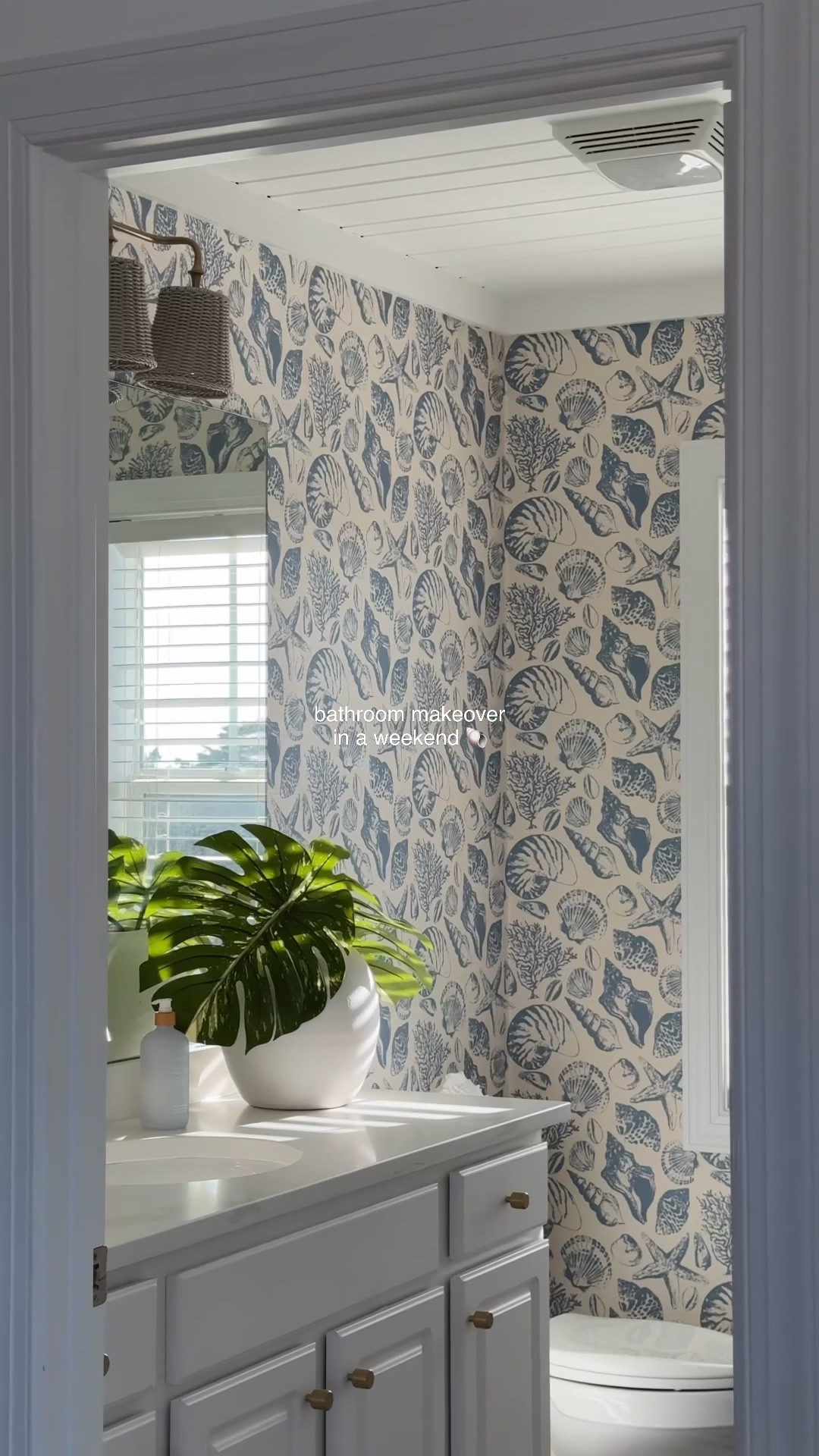 bathroom makeover in a weekend 🐚 | how amazing is this @cailinicoastal Coquillages Grasscloth wallpaper, I meannnn! 😮‍💨 -switched out the hardware + faucet & light fixture all in a weekend! #bathroommakeover 

#coastalliving #wallpaper #bathroomdesign #beachhouse 

#LTKHome #LTKSeasonal