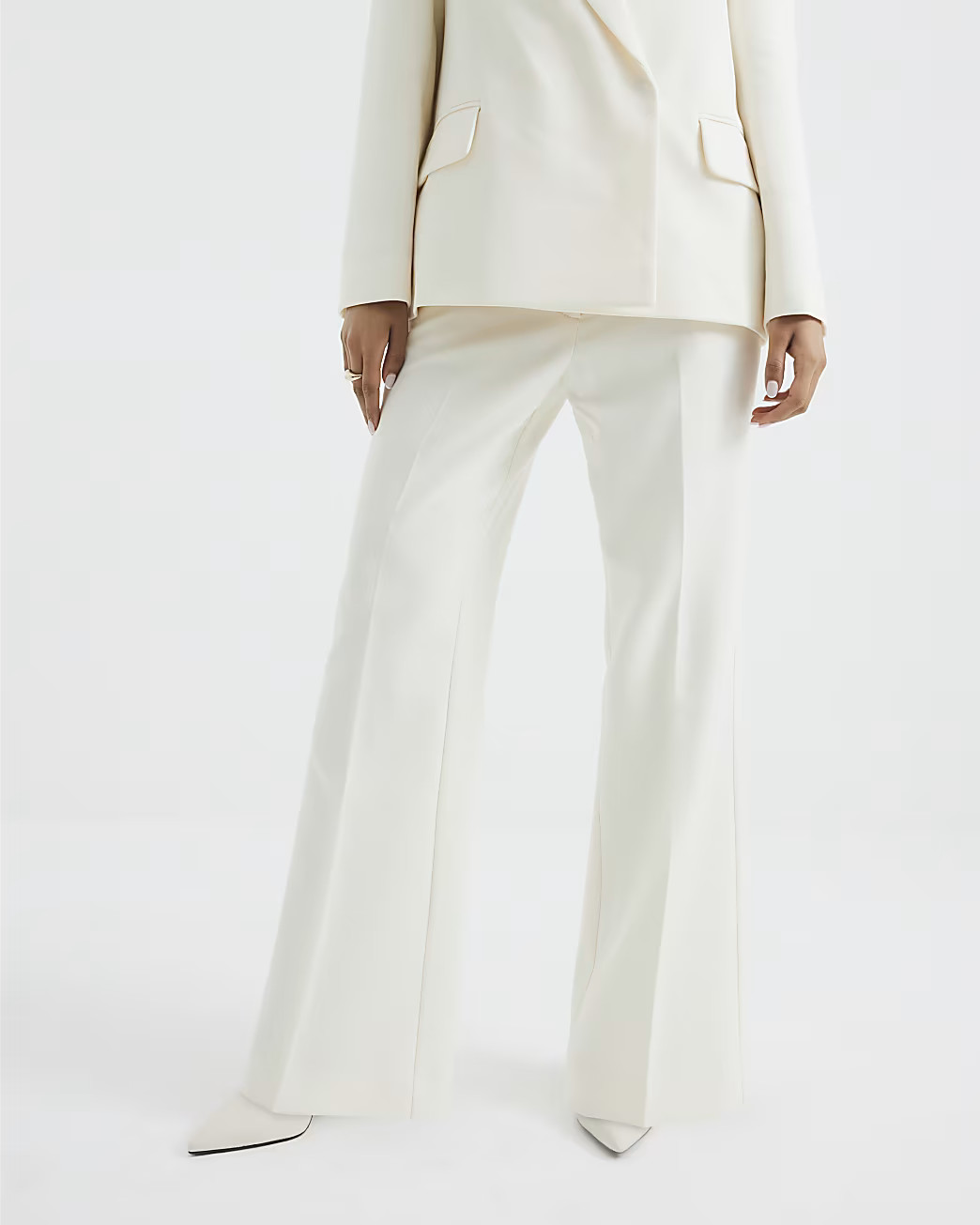 Petite Cream Slim Flared Trousers | River Island UK & IE