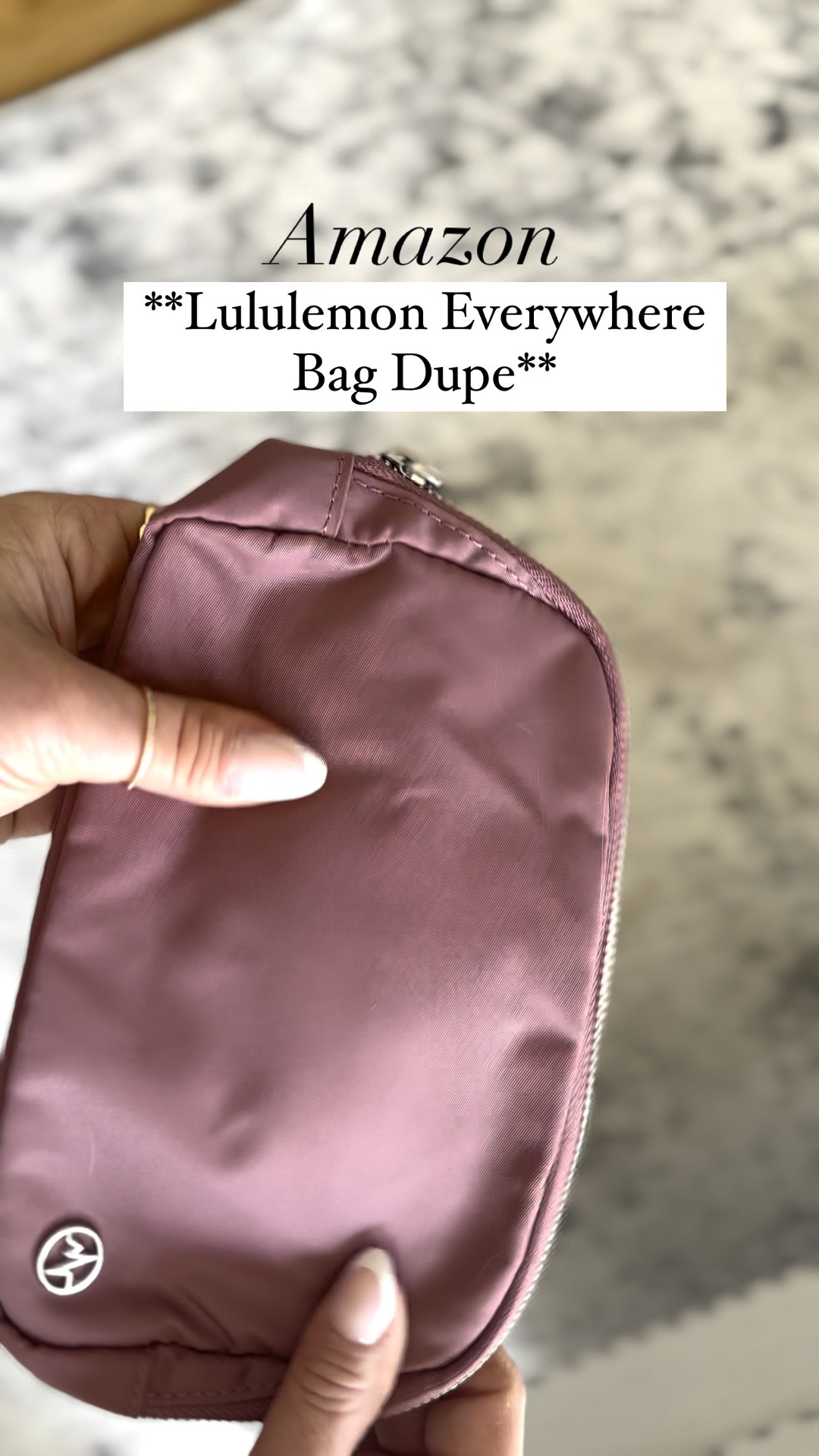 The best Lululemon Everywhere Bag dupe for half the price on Amazon! Not only is it smart with the orange inside, but the nylon fabric is waterproof and water resistant. It has 3 mesh pocket dividers in the inside and one zipper pocket outside. The outside pocket still fits iPhone 14 Pro Max perfectly. The strap is silky smooth and long enough for a larger chested girl.  It comes in 10 colors and we are absolutely in love with this!! 😍😍

#LTKstyletip #LTKfindsunder50 #LTKVideo