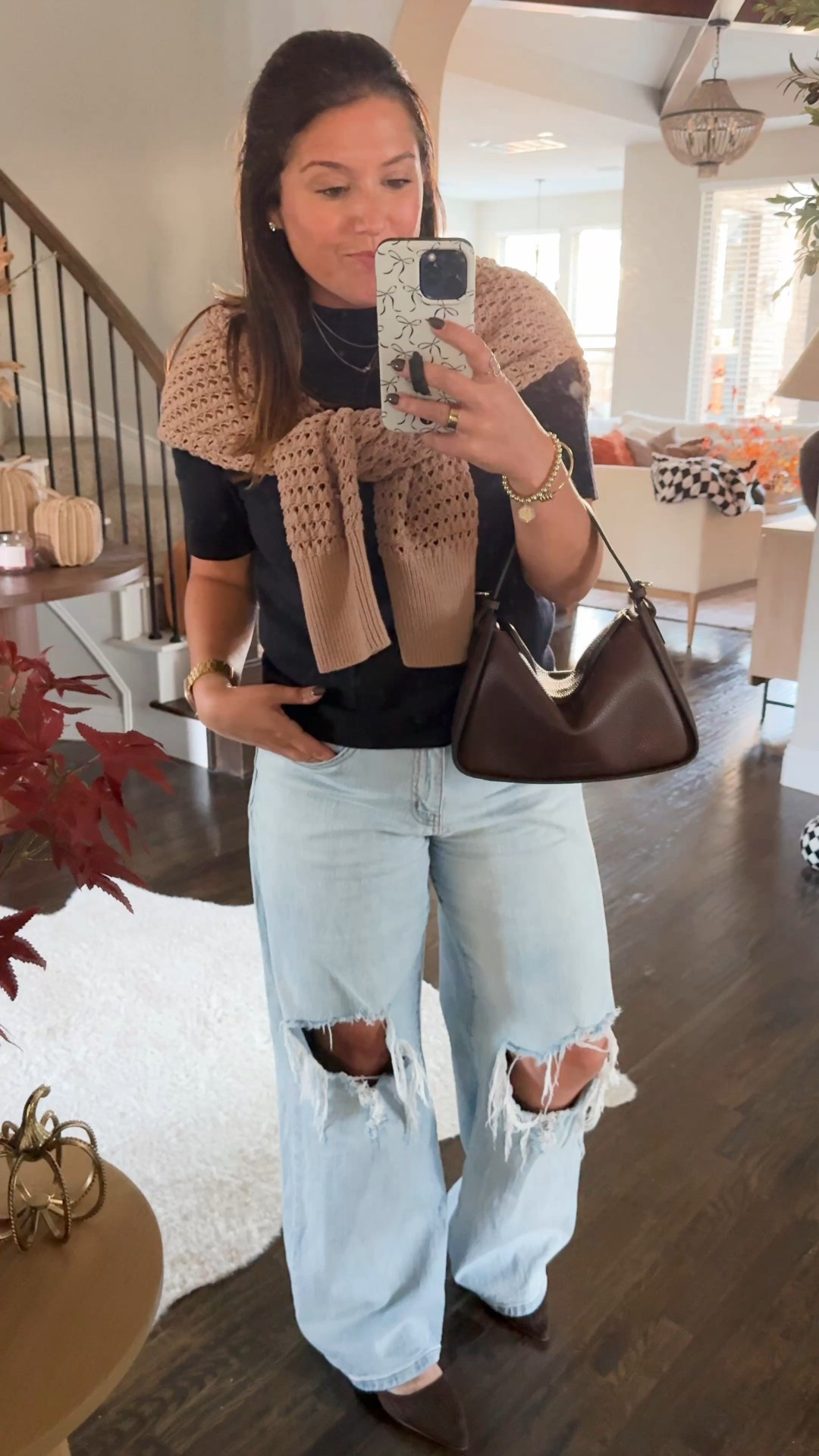 Easy fall outfit! In Texas we’re starting to feel that chill in the air but it’s not quite cold yet. So I like to make sure when I got out I have an extra layer just in case it gets cold but I also don’t wanna be too hot. Lol. Here’s an easy and super comfortable transitional outfit that could work for both the colder and warmer temps! The navy blue sweater T-shirt I’m wearing is from Mango (I love it!!). The crochet/knit zip up sweater is from Varley, the jeans are Target (discontinued 😢), and the bag is The Horse. I’m obsessed with this bag by the way! The quality is OUTSTANDING and comes with a crossbody strap if you prefer. It’s super comfortable crossbody as well but I love the slouchy look when I wear it on my arm. This brown color is back in stock. 🤎🤎 Oh and the shoes are DSW and so comfy! 

#LTKWorkwear #LTKSeasonal #LTKTravel