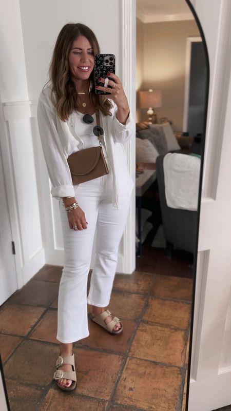 All white outfit for summer

Built in bra tank- tts-medium 
Linen long sleeve button down- sized up one size to a large
White Midrise kick out crop jeans - tts-size 28 ‼️currently on sale for $75 (originally $128)‼️

Nisolo leather Crossbody bag- currently on sale 25% off

Big buckle, Birkenstock sandals true to size 

#LTKOver40 #LTKSaleAlert #LTKStyleTip