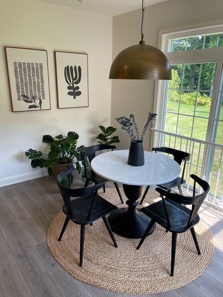 Breakfast nook
Dining area
Marble table
Wooden chairs
Black chairs 
Jute rug

#LTKhome