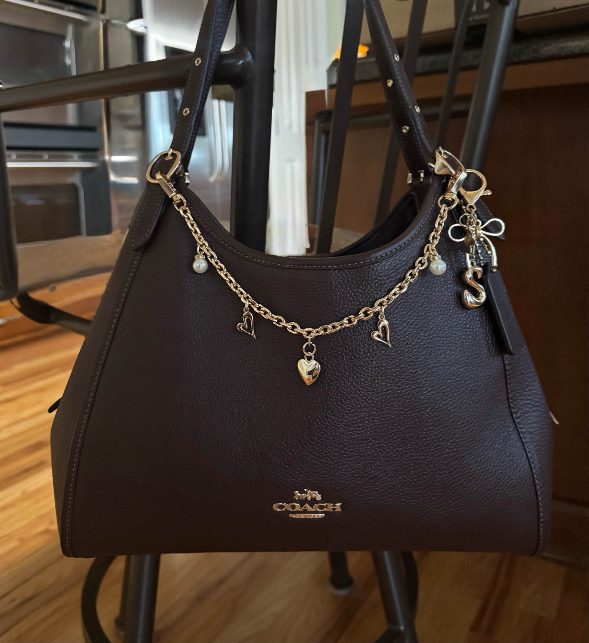 Added charms to my Coach bag! 

#LTKootd
