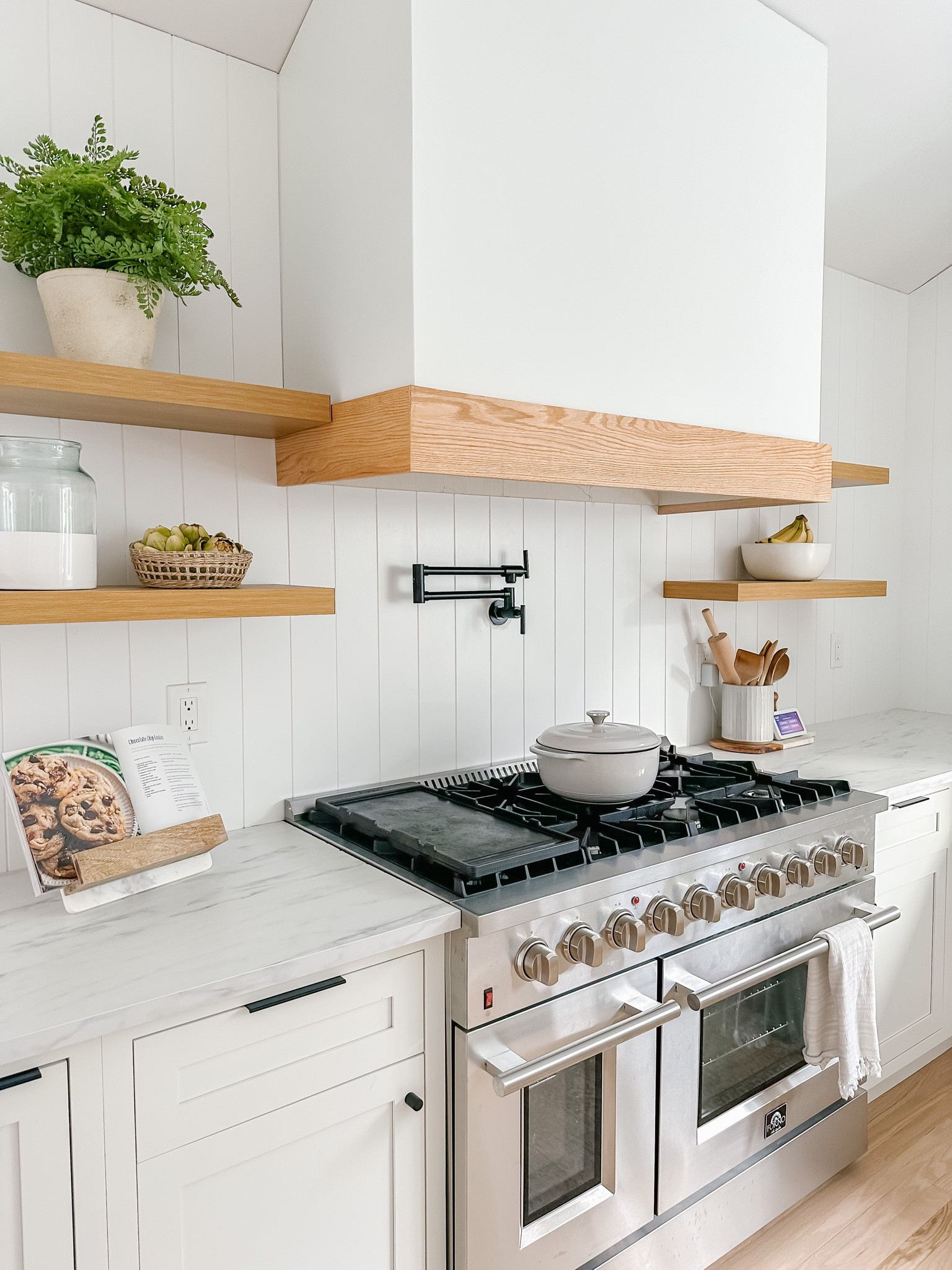 Organic Modern Kitchen Range

Wood open shelving, designer look for less, pot filler, black hardware, black pot filler, inset cabinets, kitchen decor, kitchen styling, faux plant, marble cookbook stand, stripe vase, artichokes, faux artichokes, wood utensils 

#LTKunder50 #LTKunder100 #LTKhome