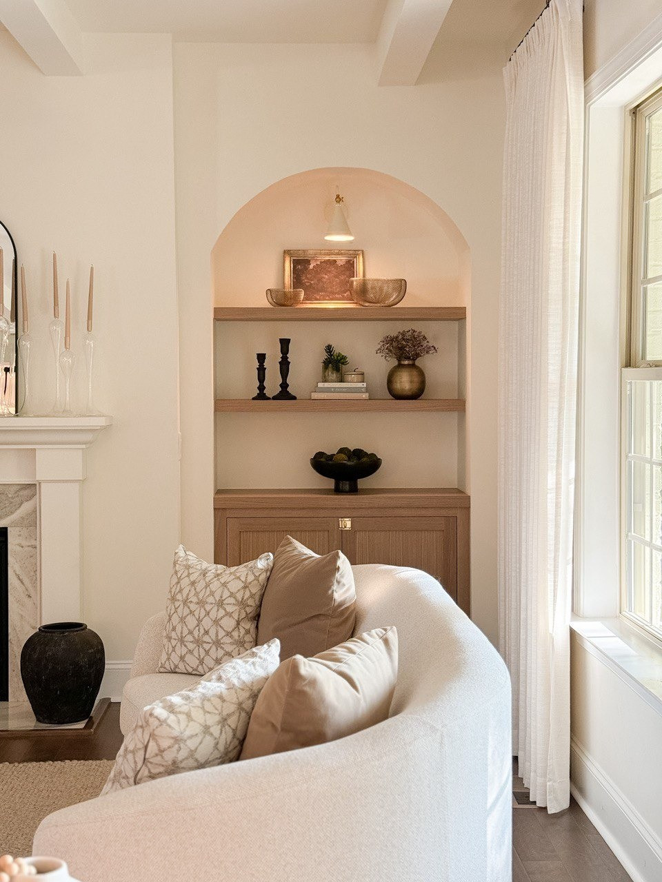 Living Room. Upholstered Sofa, Moss Bolls, Liz Linan Drape Pleated, Ceiling Light, Brass Wire Decorative Bowl, 1 Light Wall Sconce, Cogan Armed Sconce, Area Rug, Moody Trees Framed Wall Canvas Board. 

#LTKHome