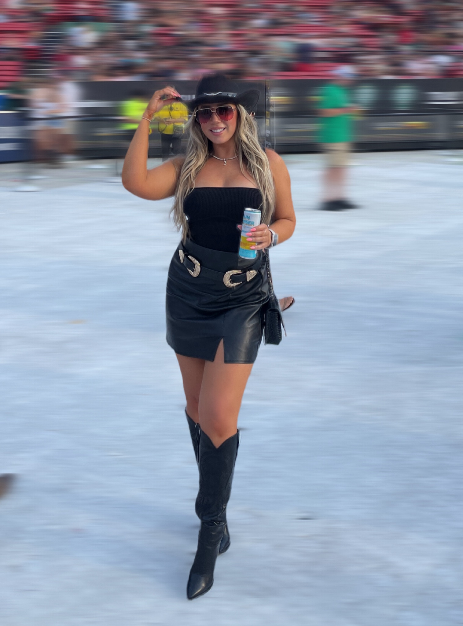 Country concert outfit inspiration! I wore a faux leather skirt, black cowboy boots, a double buckle belt and a black cowboy hat for the perfect summer concert look! 

#LTKFindsUnder50 #LTKFindsUnder100 #LTKStyleTip