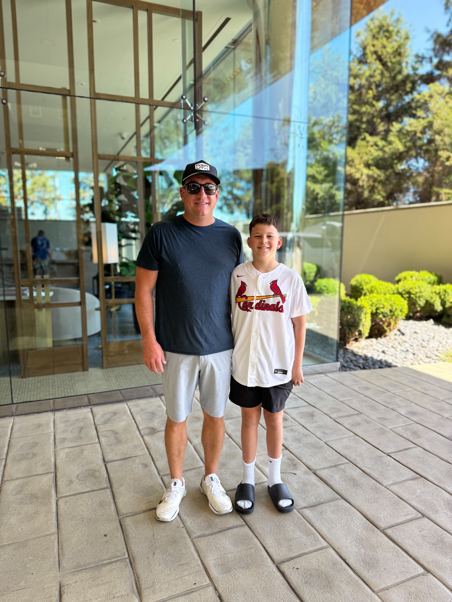 Family fun day exploring St. Louis.  Making memories together one stop at a time! 

Dad’s Outfit: navy crewneck t-shirt, light gray athletic shorts, white sneakers, black cap, black sunglasses
Son’s Outfit: St. Louis Cardinals baseball jersey, black athletic shorts, white crew socks, black slides

#FamilyTravel #StLouisAdventures #WeekendGetaway #FamilyFunDay #CardinalsBaseball #CasualMensStyle #BoysCasualStyle #TravelOutfitInspo #FamilyTravelStyle #LTKfamily #LTKmens #LTKkids #LikeToKnowIt

#LTKMens #LTKTravel #LTKKids