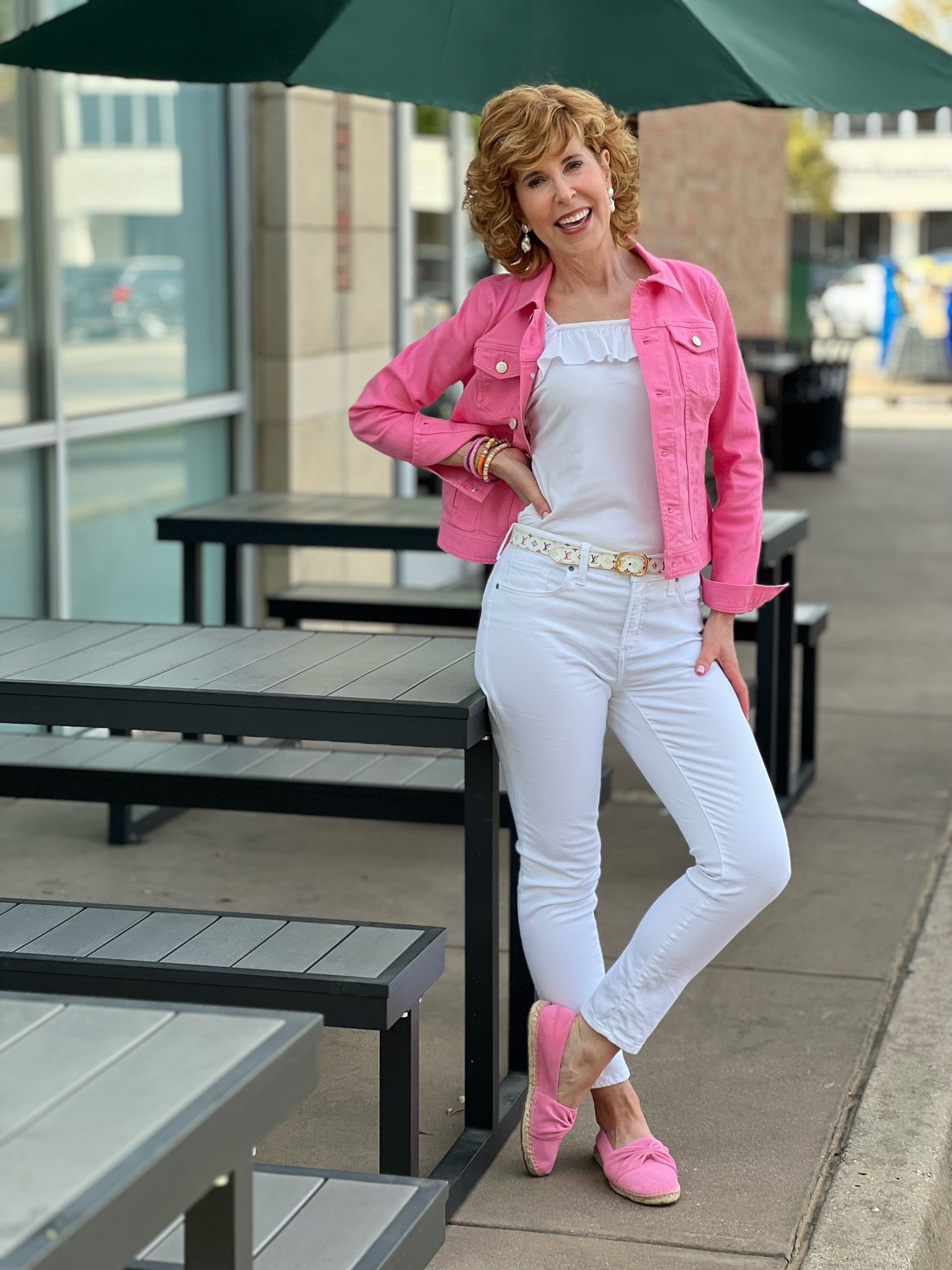 This pink denim jacket is a wardrobe staple for me!
(On sale right now!) It coordinates perfectly with my pink espadrilles. I'm wearing white No-Stain Girlfriend jeans (Yes! They're actually treated to be stain-resistant - which is great for a spiller like me!)
Underneath I'm wearing a darling ruffled tank from Amazon- it's affordable and comes in loads of colors!
I finished off with pearl drop earrings and a vintage designer belt.

#LTKstyletip #LTKSeasonal #LTKsalealert