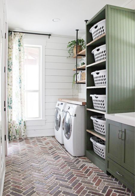 This herringbone brick floor adds so much character and warmth to the laundry room. 
#brick #brickflooring #laundryroom 

#LTKhome