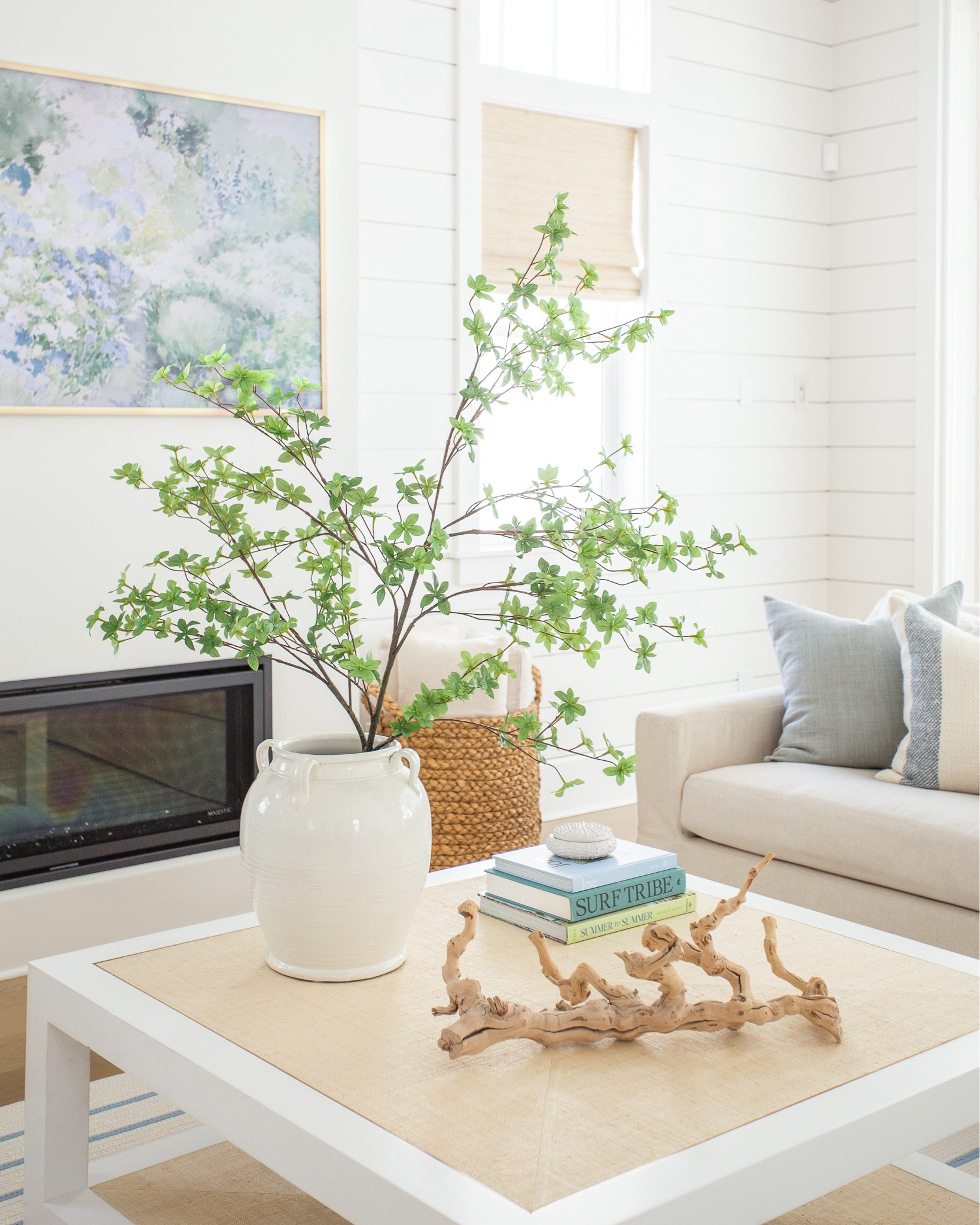 Our living room decorated for spring! Includes our favorite linen sofas, a blue and white striped rug, raffia coffee table, frame tv art for spring, a large greenery branch, blue linen pillows, paisley lumbar pillow, striped pillows, woven Roman shades, and more! See the full spring tour here: https://lifeonvirginiastreet.com/2024-spring-home-tour/.
.
#ltkhome #ltksalealert #ltkseasonal #ltkfindsunder50 #ltkfindsunder100 #ltkstyletip spring decor, spring living room, coastal decor, 

#LTKhome #LTKsalealert #LTKSeasonal