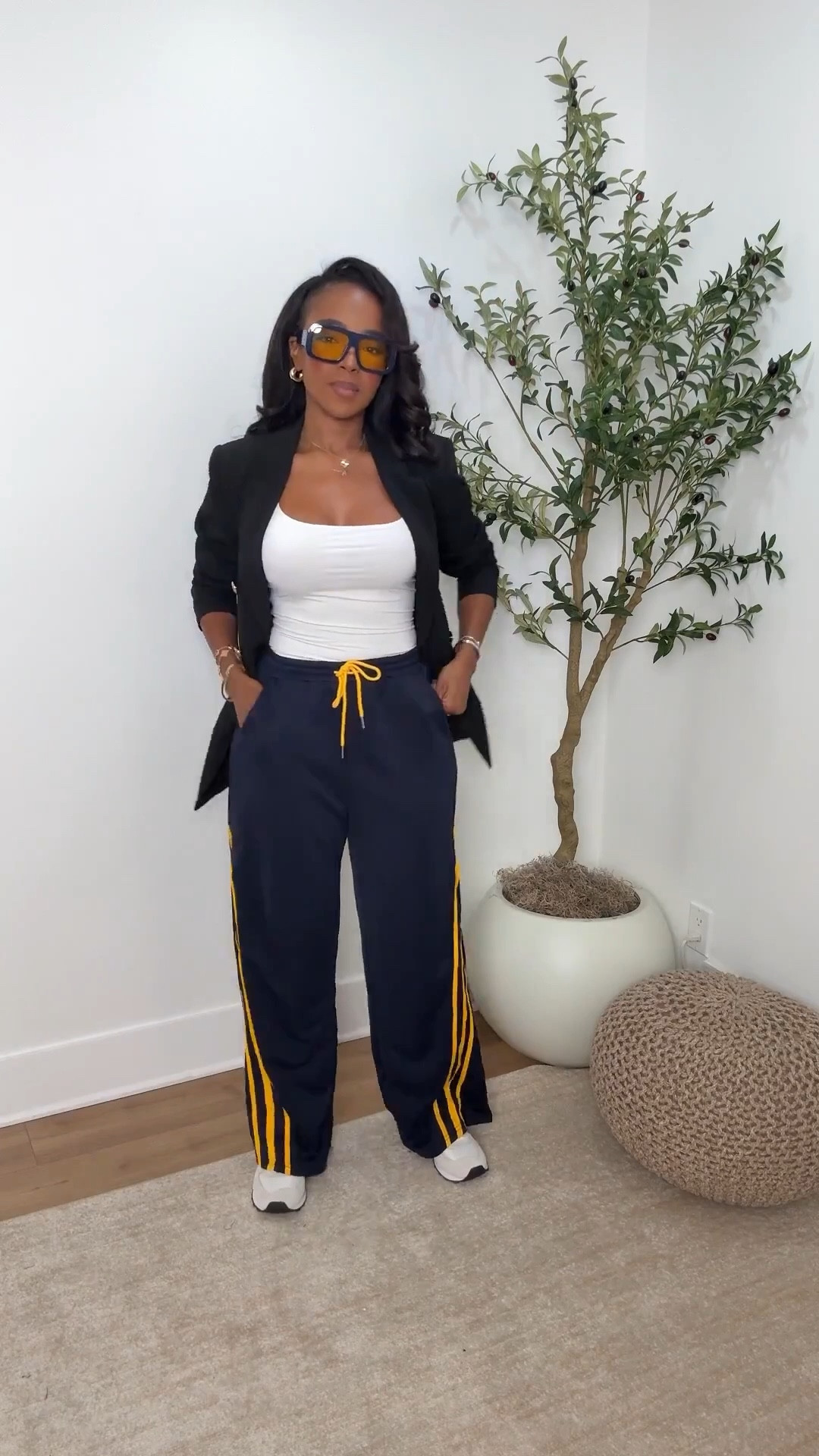 Sporty meets chic 💛 Track pants styled with a tailored blazer and bold shades for that effortless streetwear-luxe combo. Mixing comfort with confidence for an elevated off-duty vibe.  

Perfect for travel days, coffee runs, or casual Fridays. Shop instantly on the app.  

📏 Sizing: Wearing small pants + small blazer — relaxed fit with a draped structure.  

Follow my Instagram @kirasfashionfinds on the @shop.LTK app to view this post and get my exclusive app-only content!  

track pants outfit, street style look, sporty chic outfit, athleisure inspo, Kira Abboud



#LTKgrwm #LTKootd