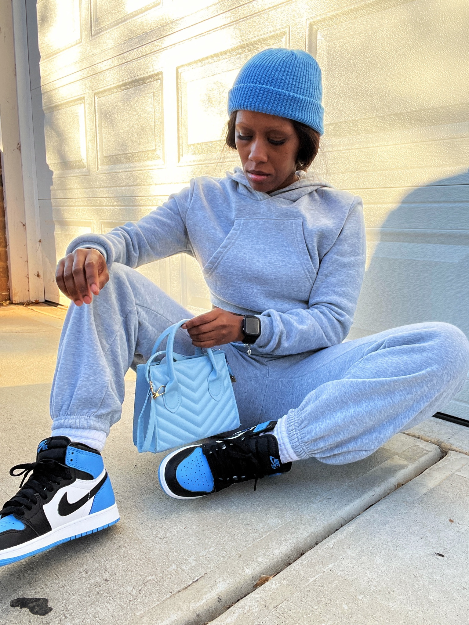 I’m wearing a grey sweatsuit with a blue beanie, blue purse, and Jordan 1 UNC toe sneakers.

#LTKFindsUnder50 #LTKStyleTip #LTKShoeCrush