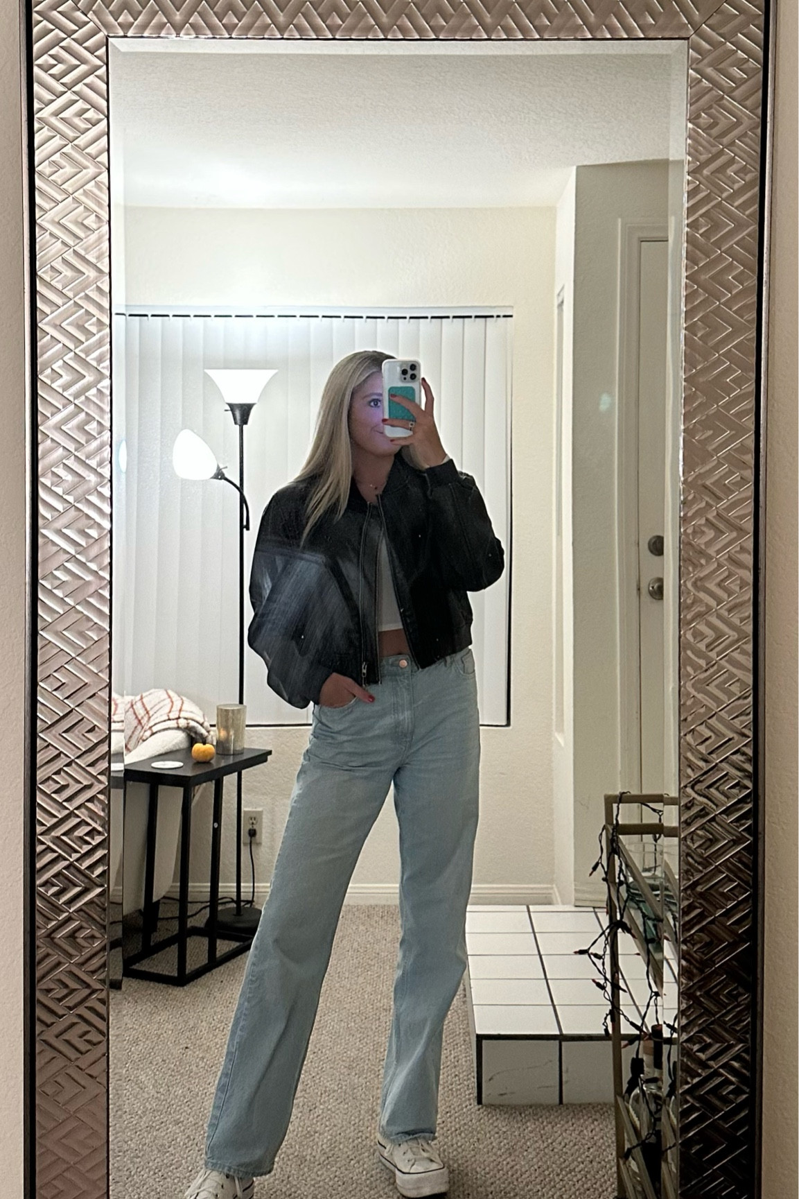 Light wash jeans and brown motto leather jacket outfit with high top converse 