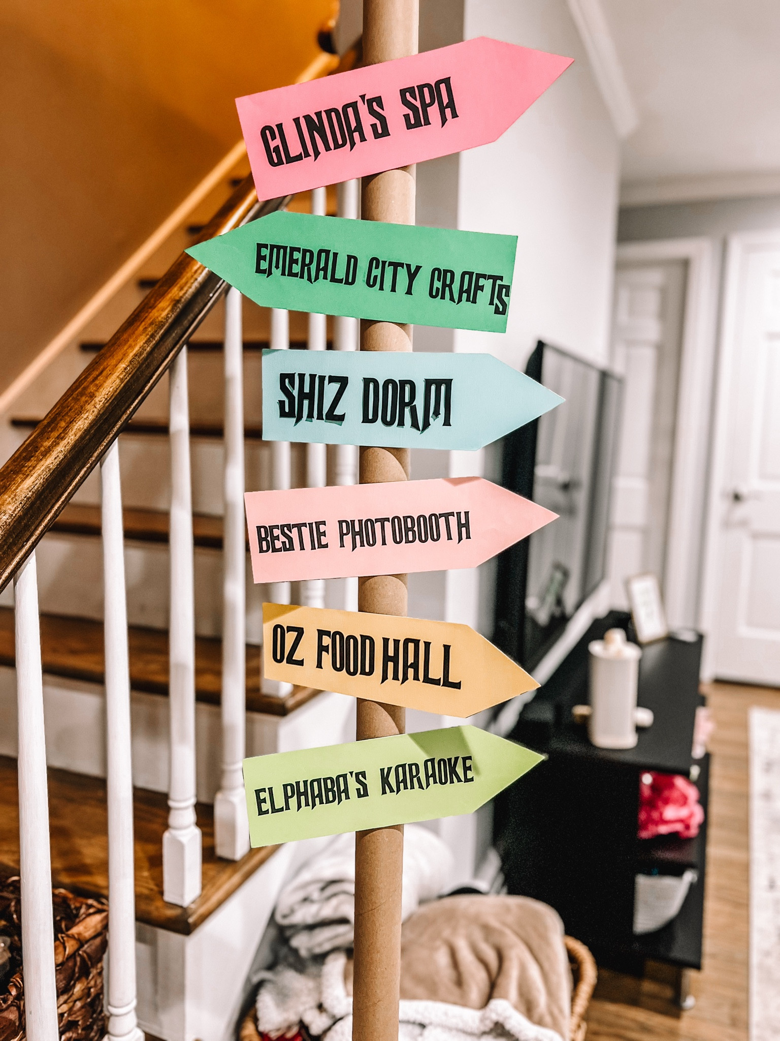 Wicked theme party: activity direction post. Made from cardstock, wrapping paper rolls and microphone stand 

#wicked #wickedparty #birthdayparty 

#LTKParties #LTKHome #LTKKids