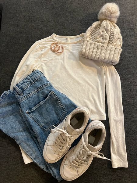 Neutral Winter outfit with white long sleeve, blue jeans, white sneakers, beanie, and gold accessories 

not linked:
Jeans: Zara