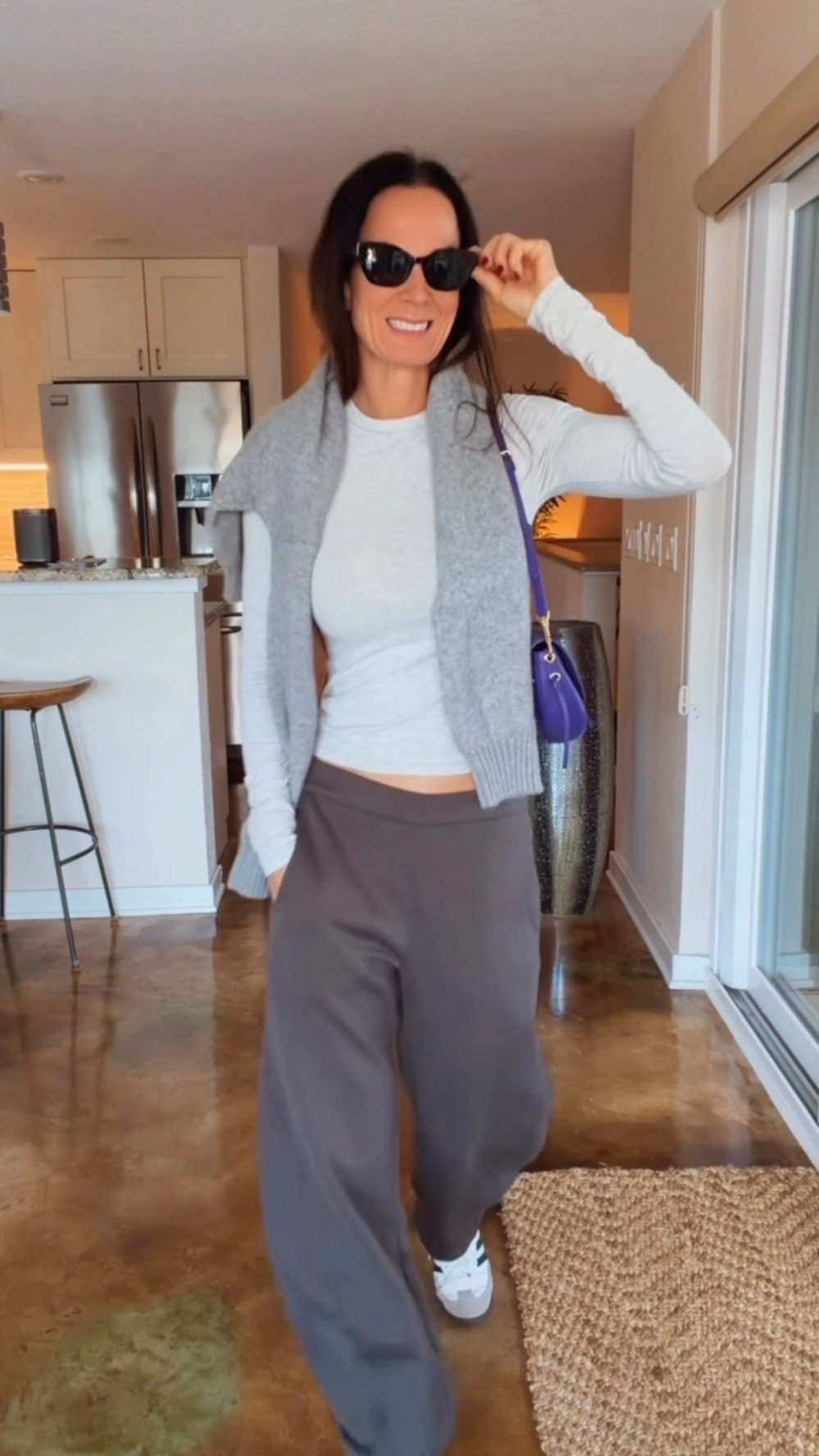 Comfortable pants, a very put-together outfit. 🩶 Styling the RUTI On The Loose Work Scuba Pants in Storm Gray with a fitted long-sleeve top, sneakers, a sweater over my shoulders, and a pop of purple. An easy outfit idea for travel, errands, or a casual lunch. Use NICOLE15 for 15% off RUTI.

#LTKdayinmylife #LTKgrwm #LTKootd
