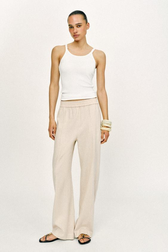 Trousers made from a linen blend. High-waist with an elastic waistband. Featuring front pockets a... | Zara UK