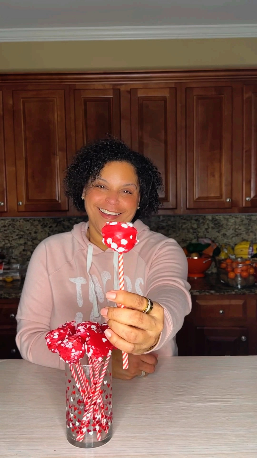 EASY VALENTINES CAKE POPS // I love a good cake pop and since learning how to make a semi homemade version, it’s one of my favorite treats to make. These Valentine’s Day ones are super cute - and also tasty.

You’ll need
- 1 box Little Debbie Valentine Cakes
- Red candy melts
- Straws or lollipop/candy sticks
- Sprinkles
- Optional - cellophane bags & ribbon

Let’s make it
- Unwrap individual cakes and place in large bowl
- Using a mixer or spoon, break up cakes and combine
- Using a mini scoop or spoon, scoop about 1 tbsp of the cake into hand
- Roll between palms to create a round shape
- Place on wax paper lined sheet pan
- Insert straw or stick
- Pinch cake around straw or stick if there are gaps
- Place in freezer for 10 minutes
- Add meltable candy to bowl and heat until melted (according to package)
- Dip cake pops into the melted candy
- Add sprinkles immediately
- If desired, place in cellophane bags after the pops have dried and tie with ribbon

These cake pops are yummy and beautiful. Are you Team Cake Pop?


#LTKValentine #LTKfoodie #LTKmomlife