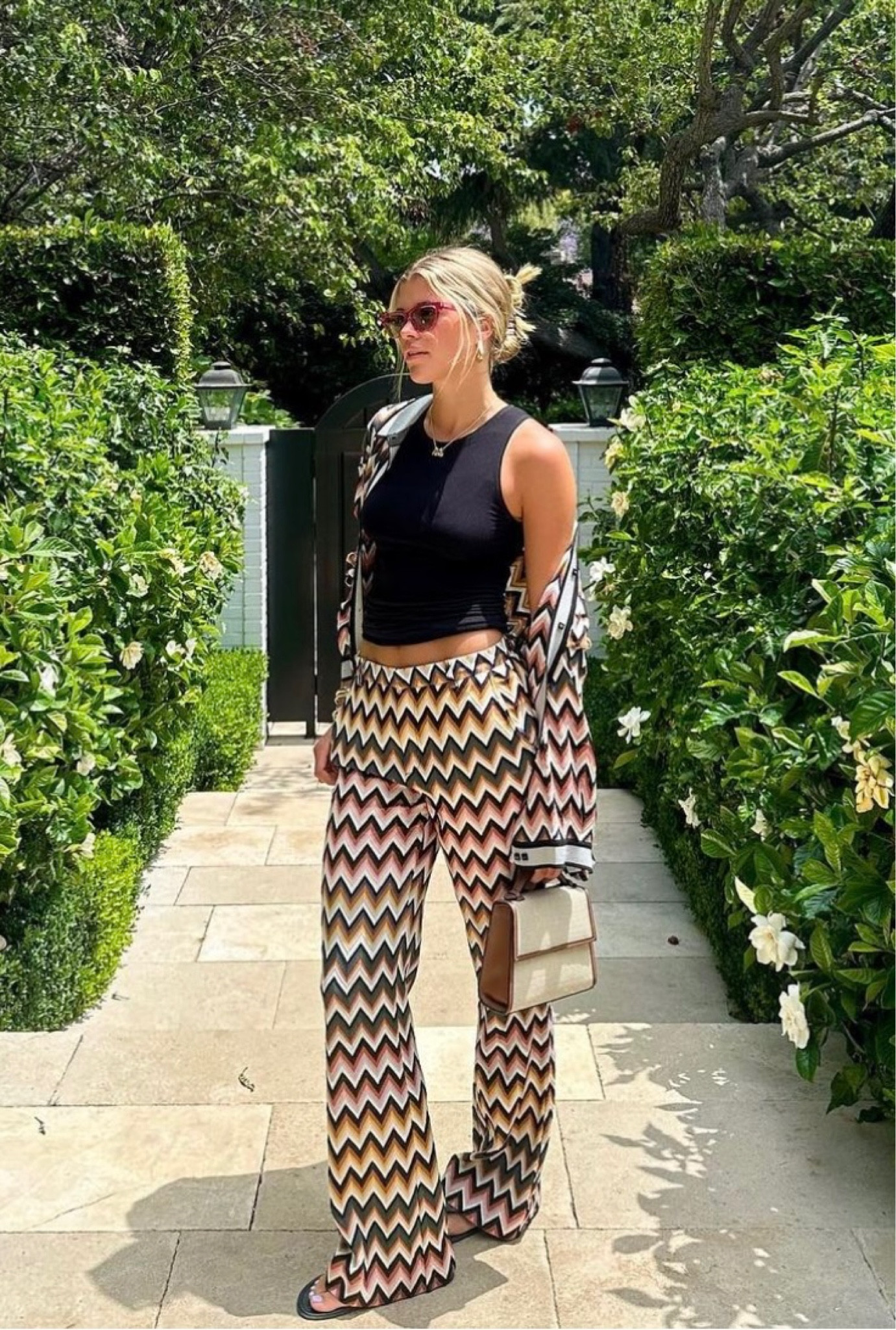 Shop Sofia Richie Grange's viscose and wool zigzag trousers button up shirts butterfly frame sunglasses, leather and raffia tote bag

#LTKFind #LTKxNSale #LTKstyletip