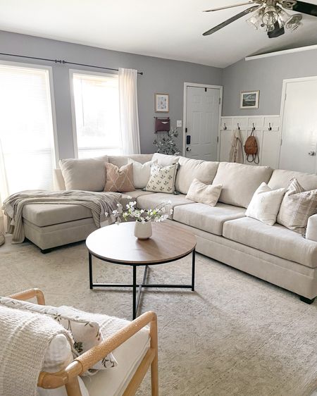 Sofa can’t be linked but it is from 
LivingSpaces.com - Bonaterra Sand 127” 2 Piece Sectional With Left Arm Facing Corner Chaise

Linked pillows and coffee table! 

Home, living room, decor, sofa, sectional, beige, white, cozy, affordable, round coffee table, small, home interior, home design 

#LTKstyletip #LTKhome #LTKFind