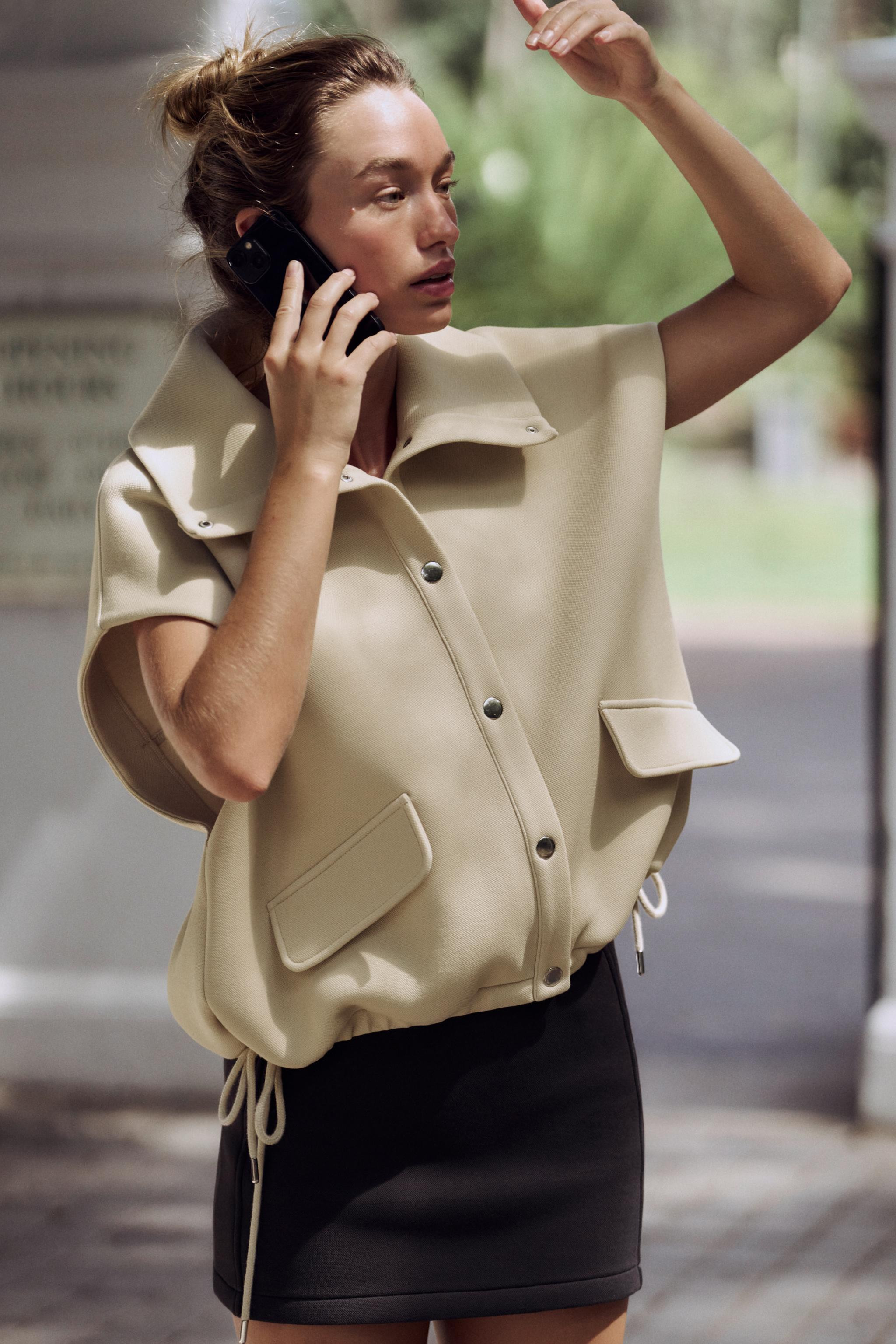 High neck vest. Lapel detail on front. Adjustable hem with drawstrings at sides. Front snap butto... | Zara US