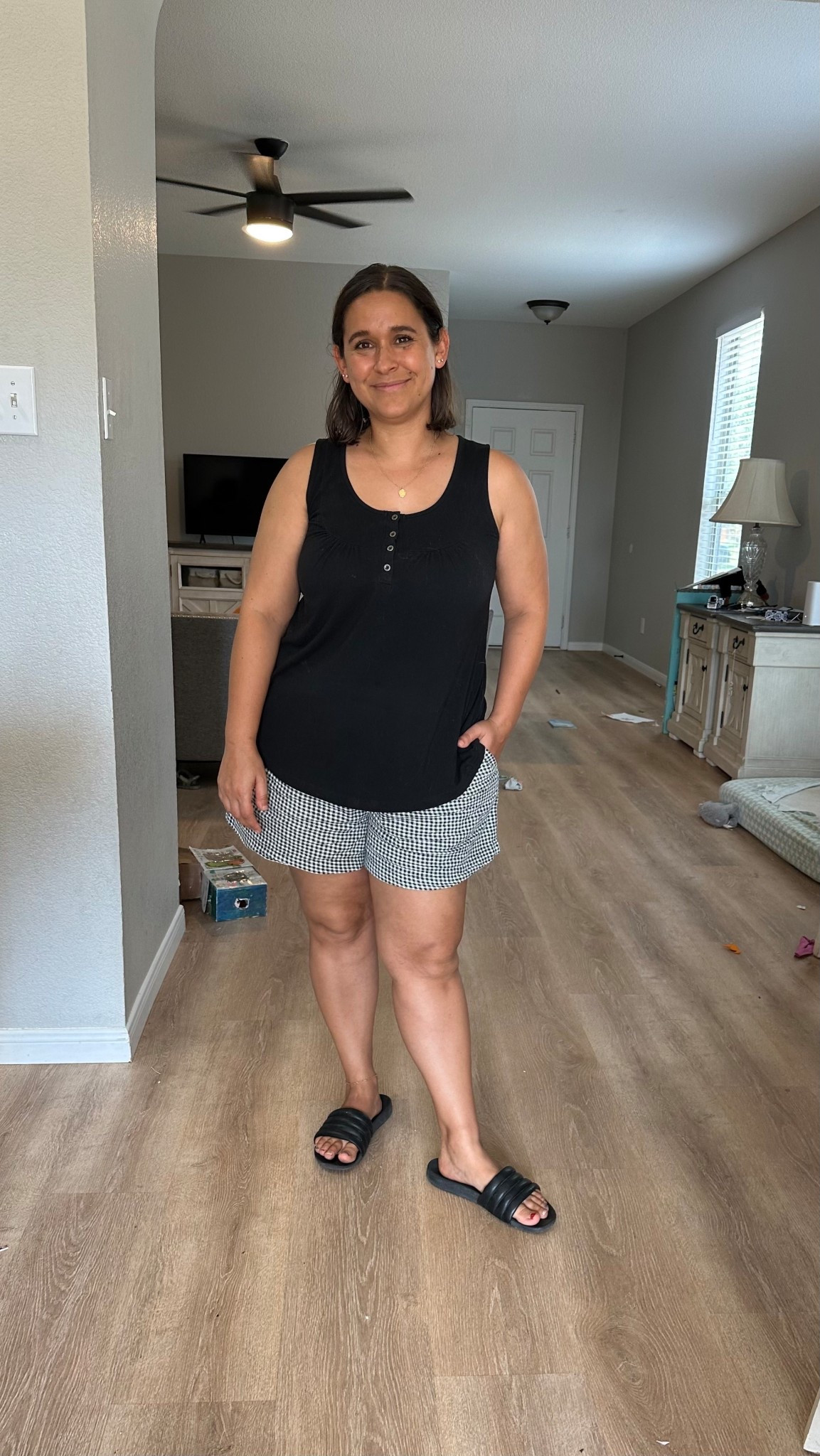 Casual black and white outfit. 

Black tank | gingham shorts

#LTKStyleTip #LTKMidsize #LTKFindsUnder50