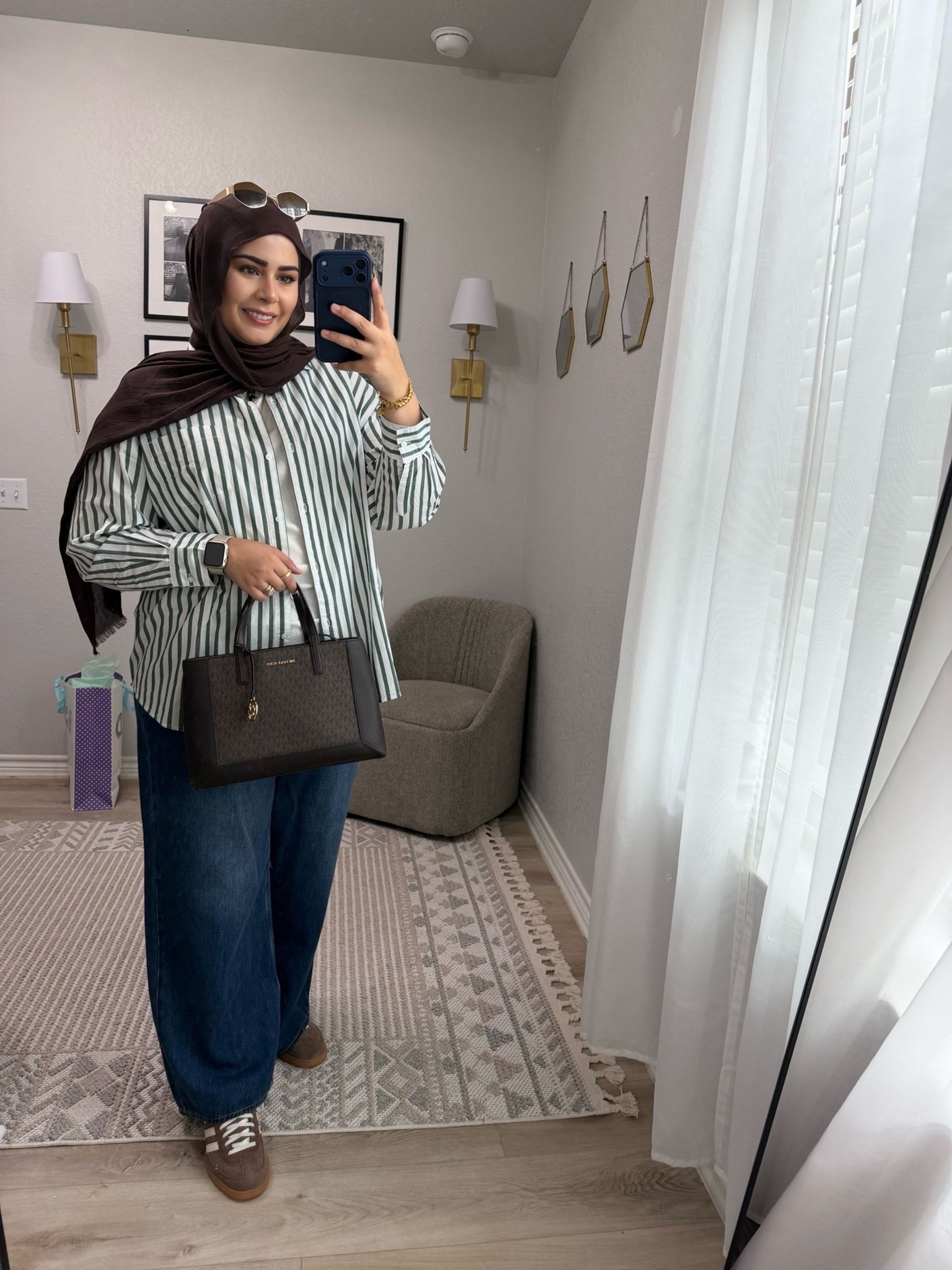 Elevated everyday basics ✨
An easy mom-friendly outfit that still feels put together — striped button down, relaxed denim & neutral accessories. Everything is comfy, modest, and on repeat lately 🤍

Wearing size US 12 in jeans and size L in the button down.

#LTKootd #LTKSaleAlert #LTKgrwm