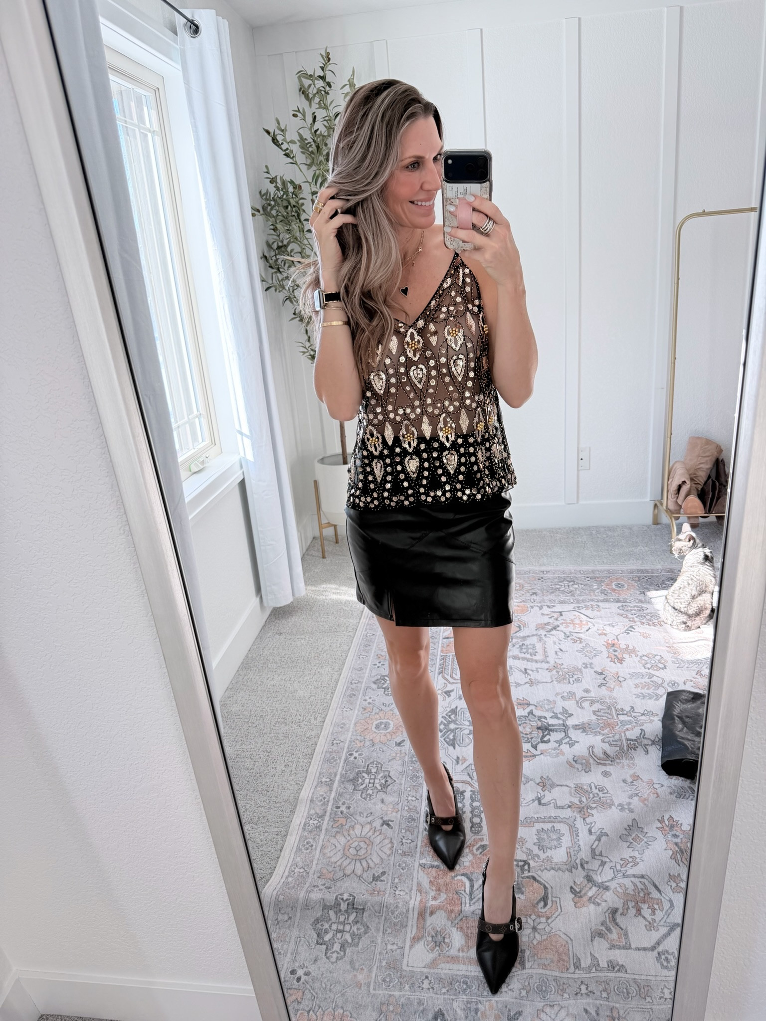 This dressy casual look is perfect for a night out, girls’ night, or holiday party. Styled a printed sleeveless top with a black faux leather mini skirt and classic black pointed-toe heels for an elevated, flattering outfit that works year-round. 

date night outfit, faux leather mini skirt, dressy casual outfit, women’s night out outfit, sleeveless top outfit, black heels outfit, evening outfit inspiration, stylish outfit over 30

#LTKootd #LTKHoliday #LTKFindsUnder100